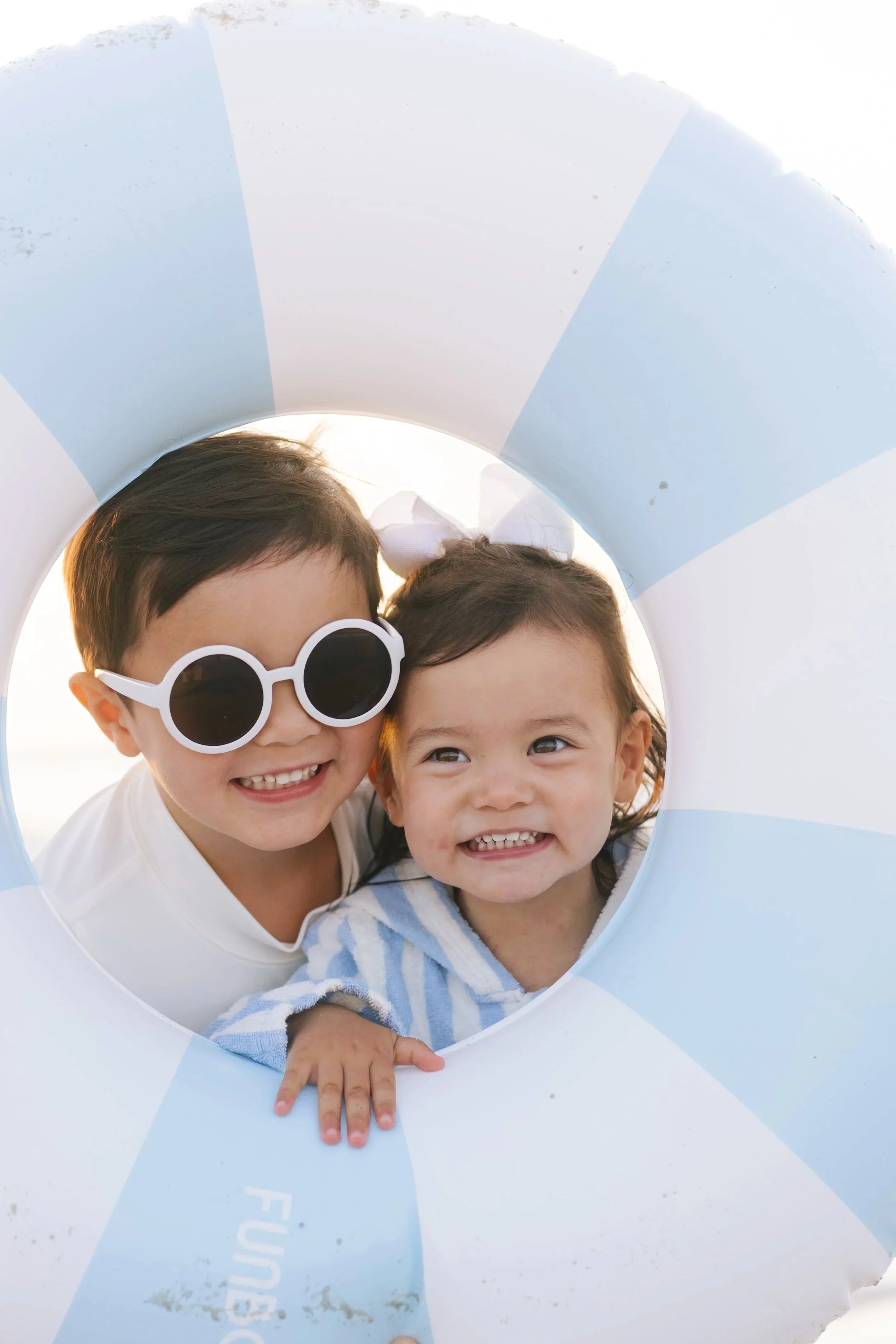 Two smiling children at Swell Smiles Pediatric Dentistry in Jacksonville, FL