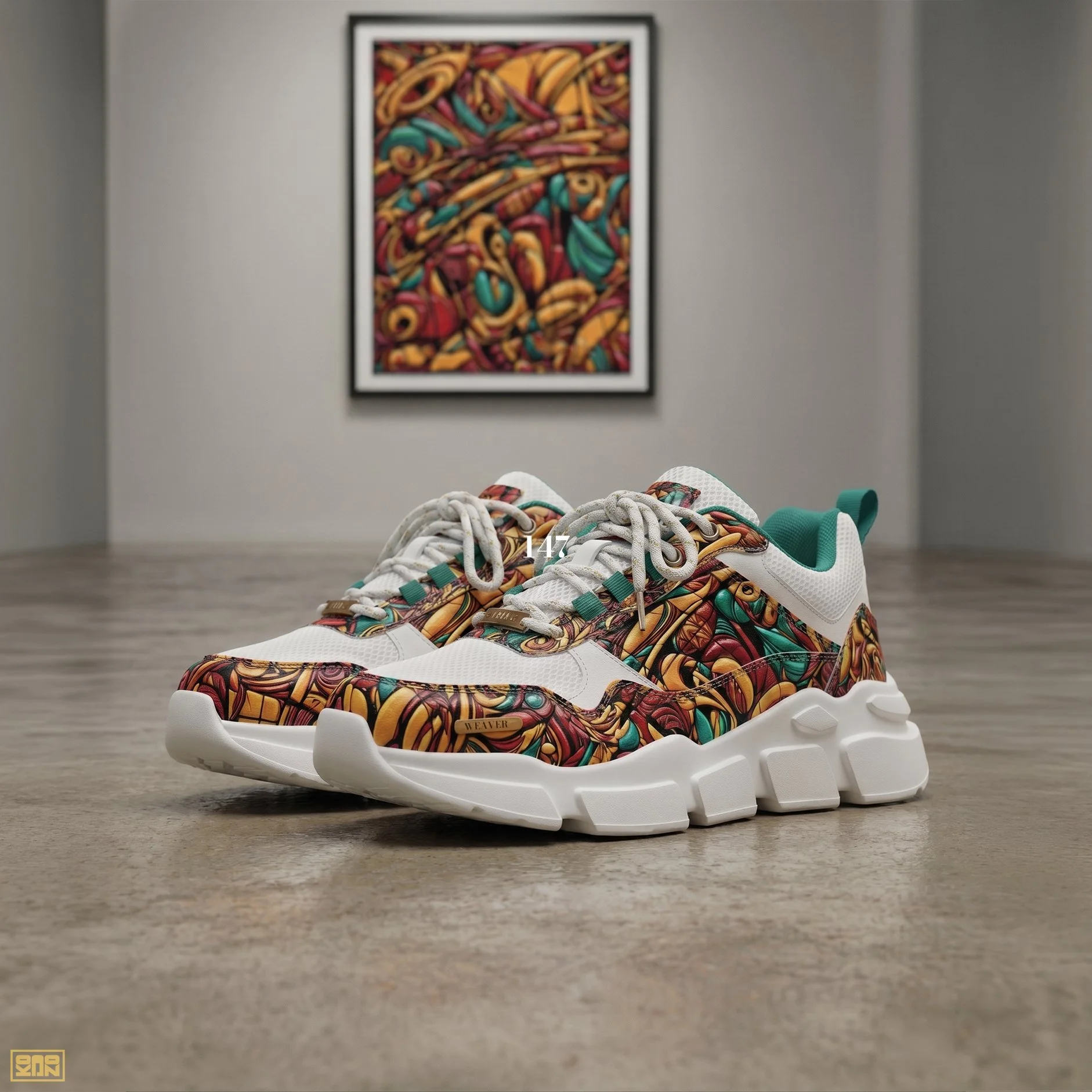 Pair of sneakers with a colorful, abstract swirl pattern on the upper part, placed on a wooden floor with a gray wall in the background. There is a framed abstract artwork on the wall behind the shoes.