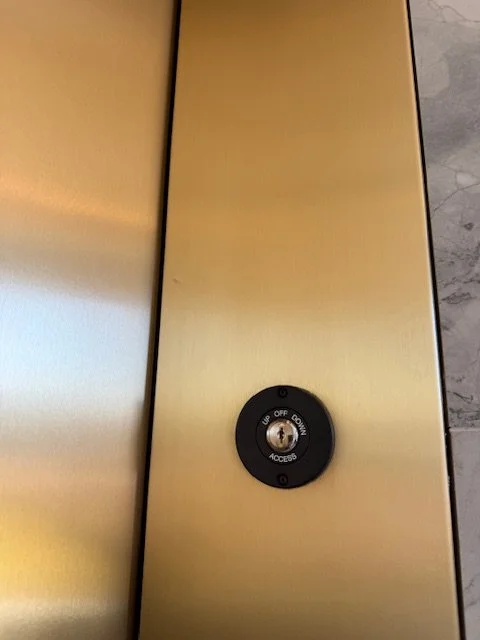 After Satin Finish Bronze Elevator Frame