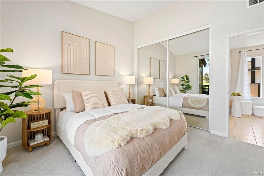 Soft blush tones, warm neutrals, and plush textiles transform this bedroom into a sophisticated retreat. Balanced styling and understated décor give the space a calm, upscale feel designed to appeal to discerning Orange County buyers.