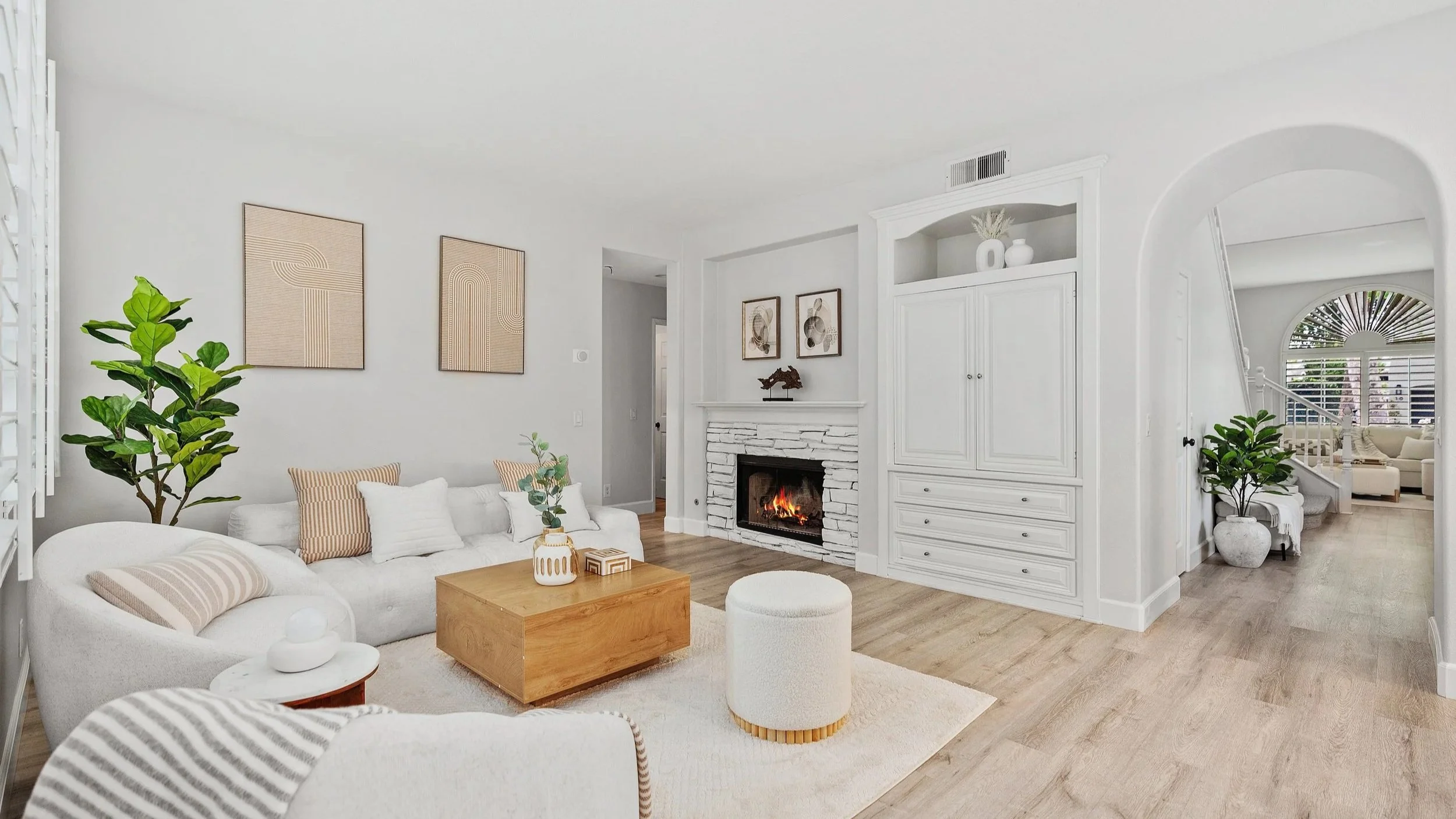 Staged living room with view to family room