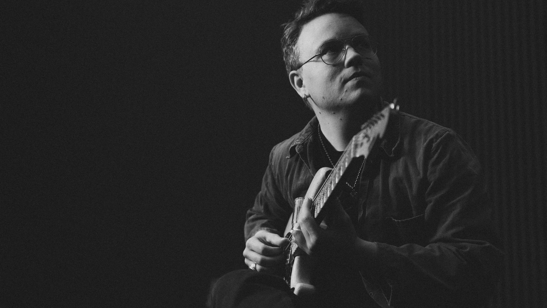 Johan Borgh playing electric guitar at IMRSV Studios.