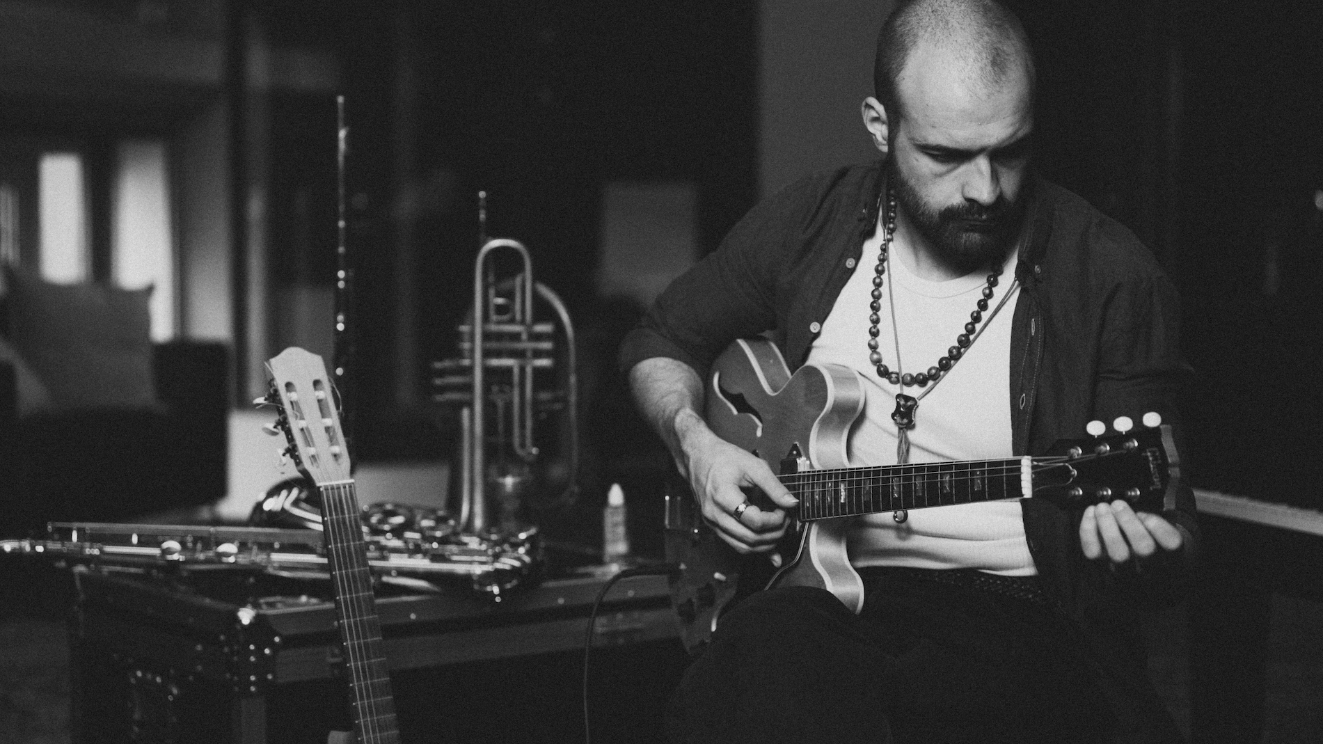 Axel Berntzon playing guitar at IMRSV Studios.