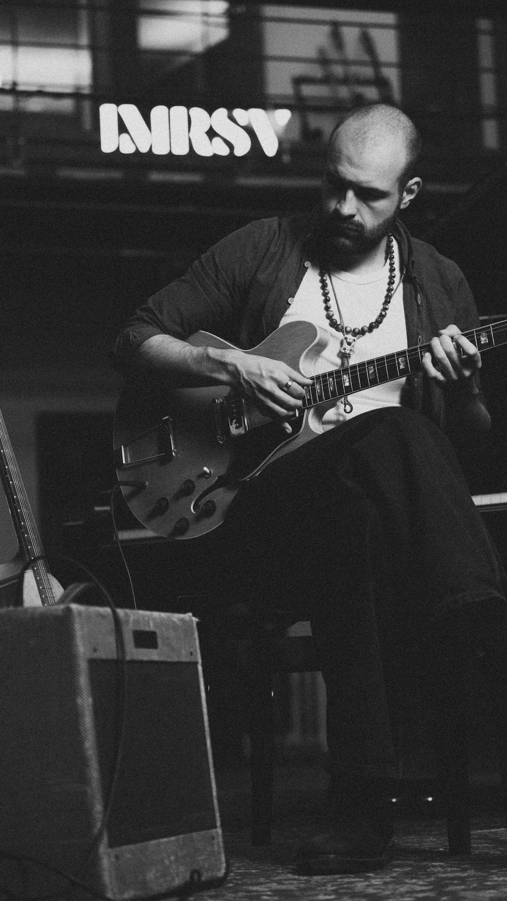 Axel Berntzon playing guitar at IMRSV Studios.