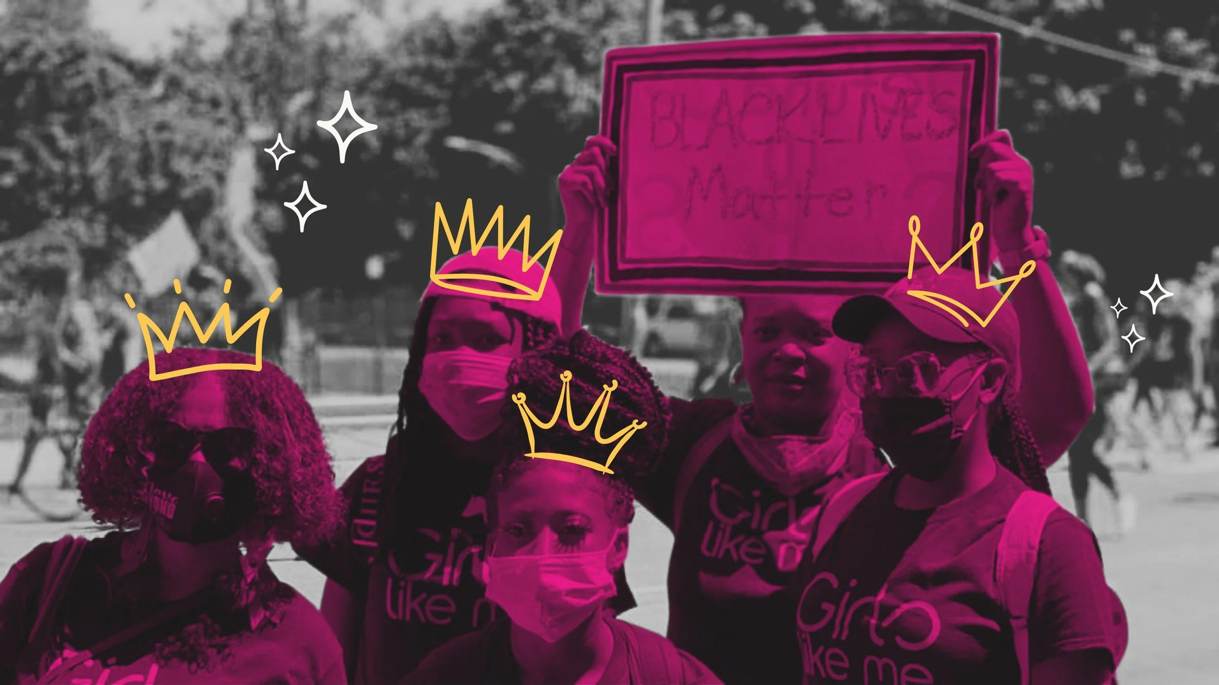 Young girls supporting the Black Lives Matter movement, with parents.