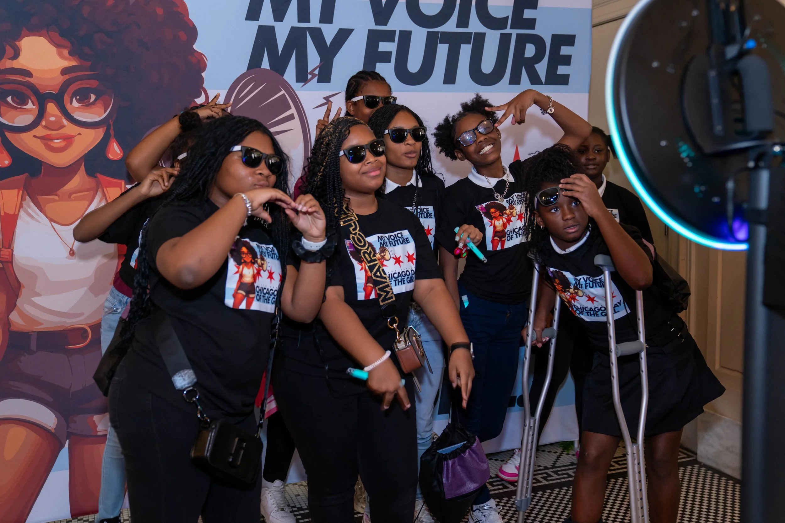 Girls in the GLMPI program taking a picture with sunglasses on.