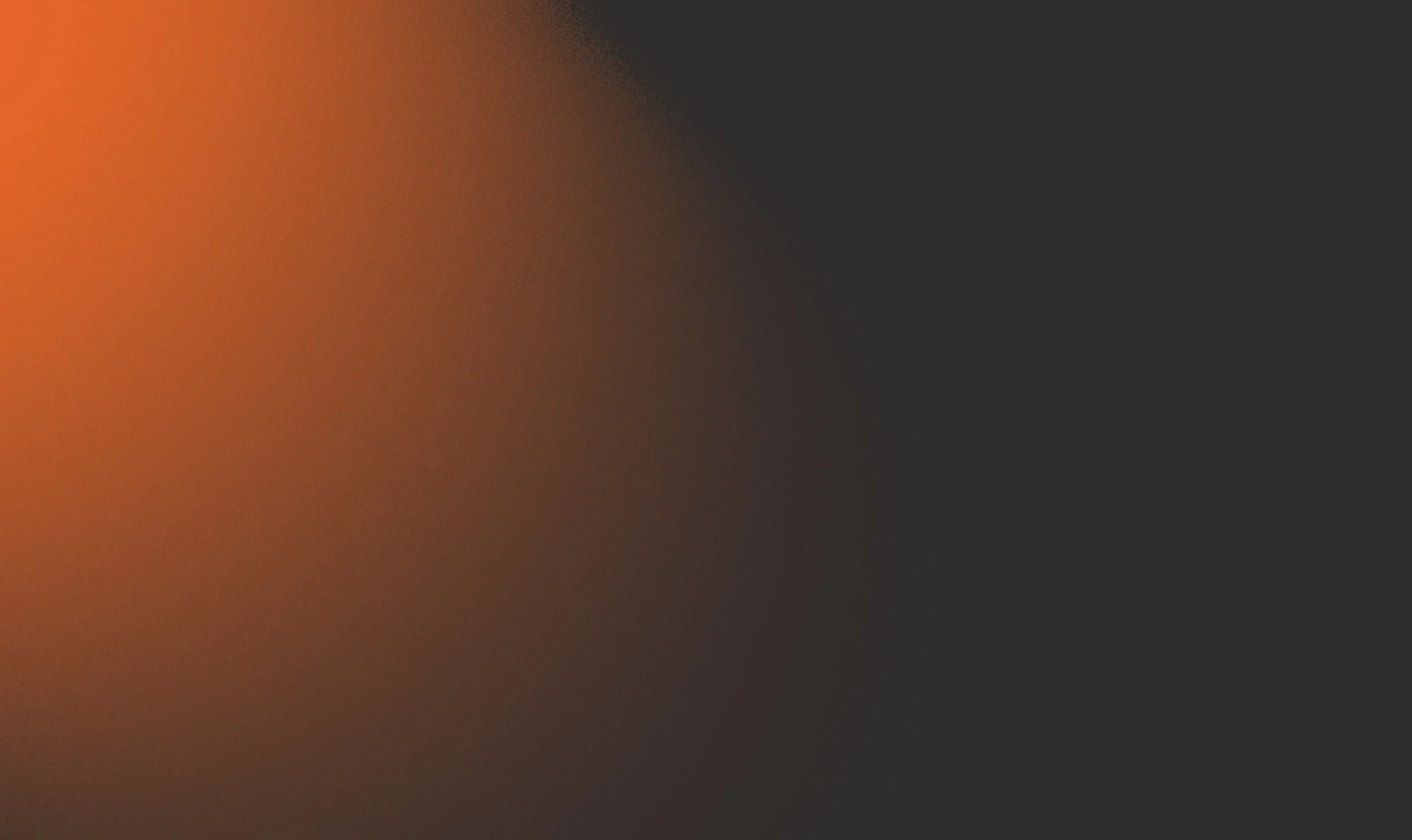 A blurred gradient background transitioning from orange to black.