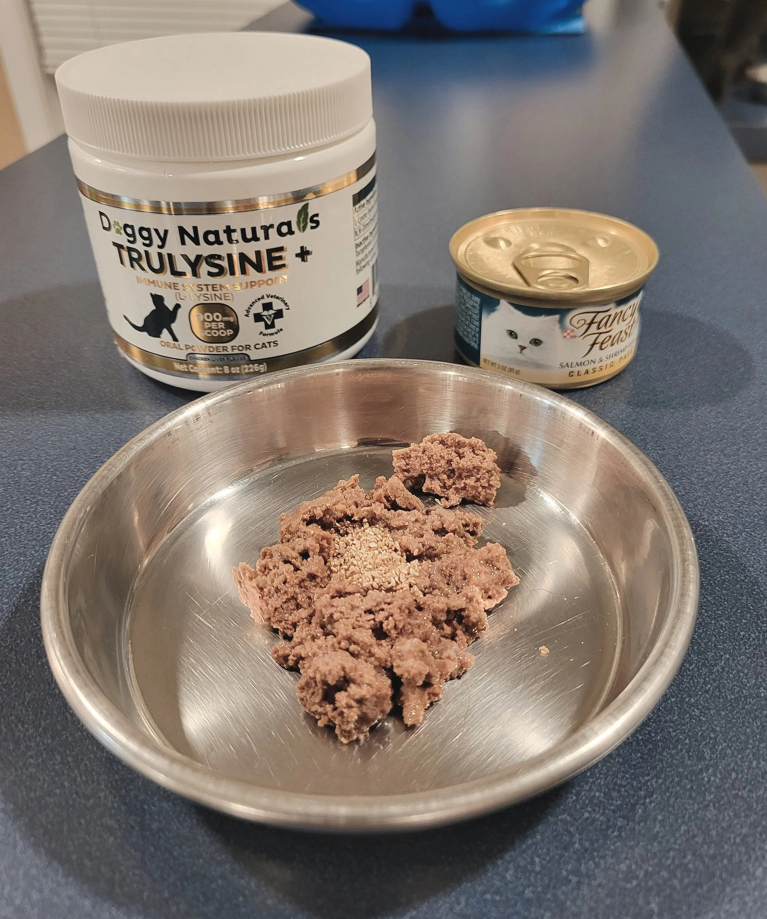 Friskies and Fancy Feast cat food fortified with pure L-Lysine powder for feline immune support.