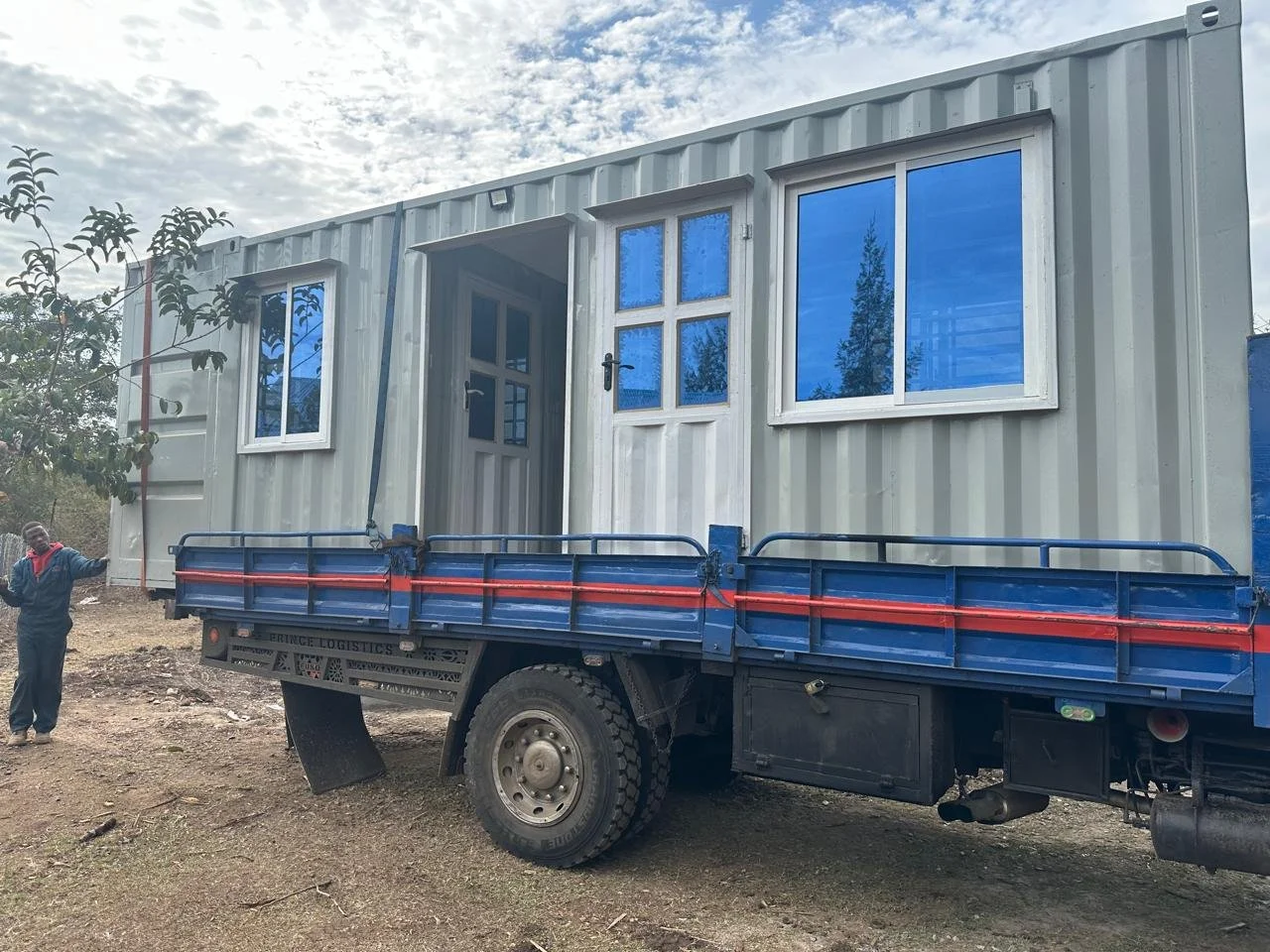 A shipping container on a truck bed.
