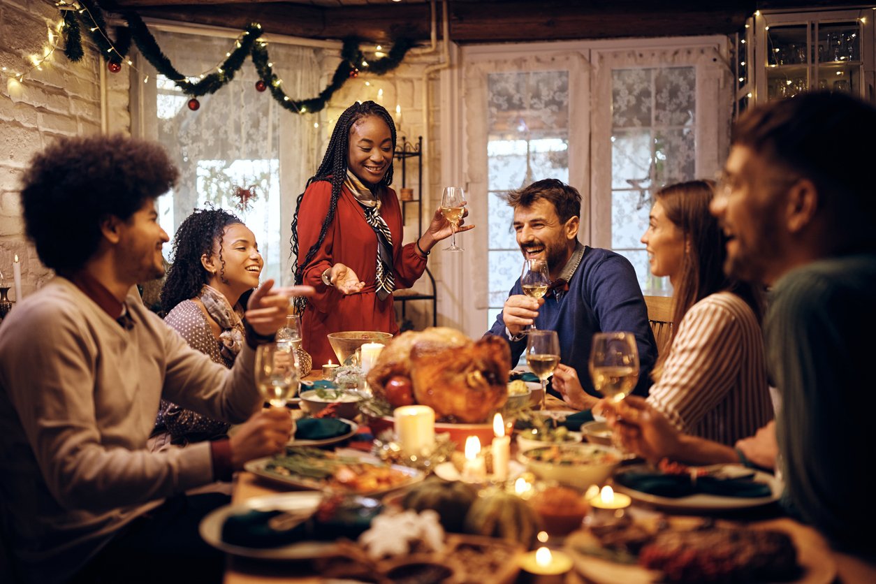 Managing the winter blues - A group of friends having a Christmas dinner at home.