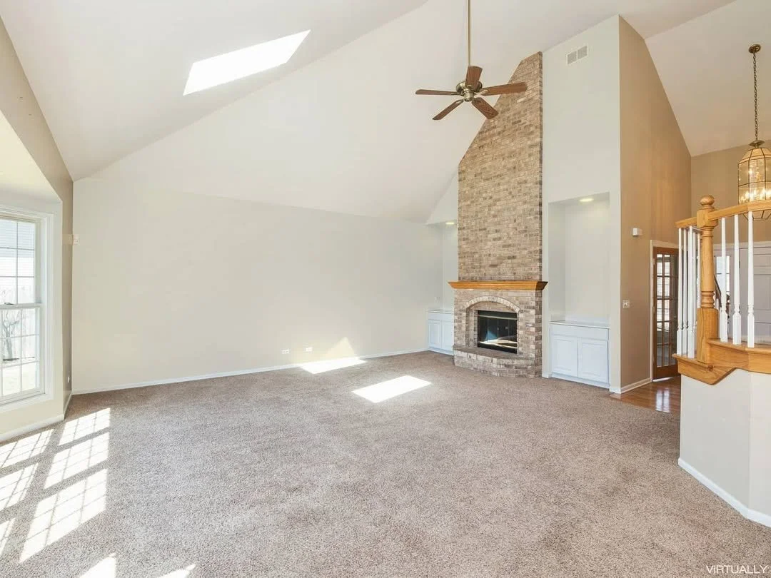Living room with a single new coat of paint, brightening up the room.