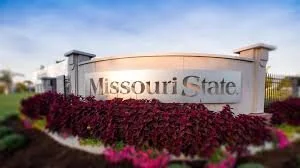 Missouri State University sign with landscaped flowers in front