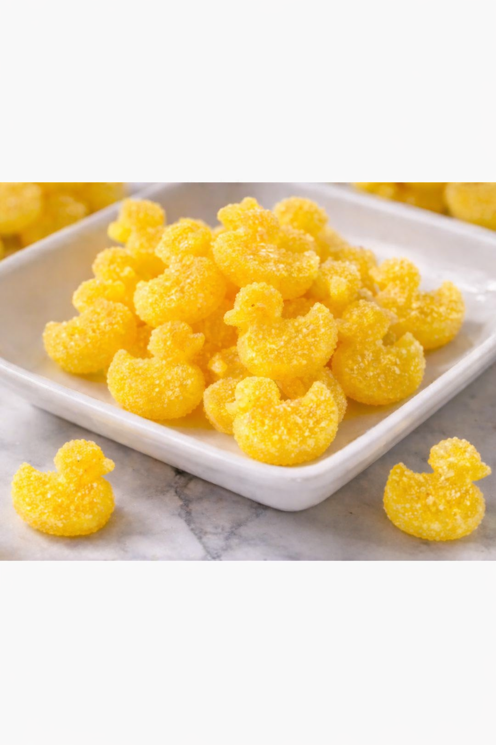 Yellow gummy ducks with sugar coating.png