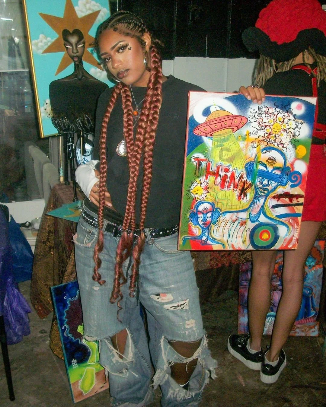 young black women displaying artwork at the breathe in color studio