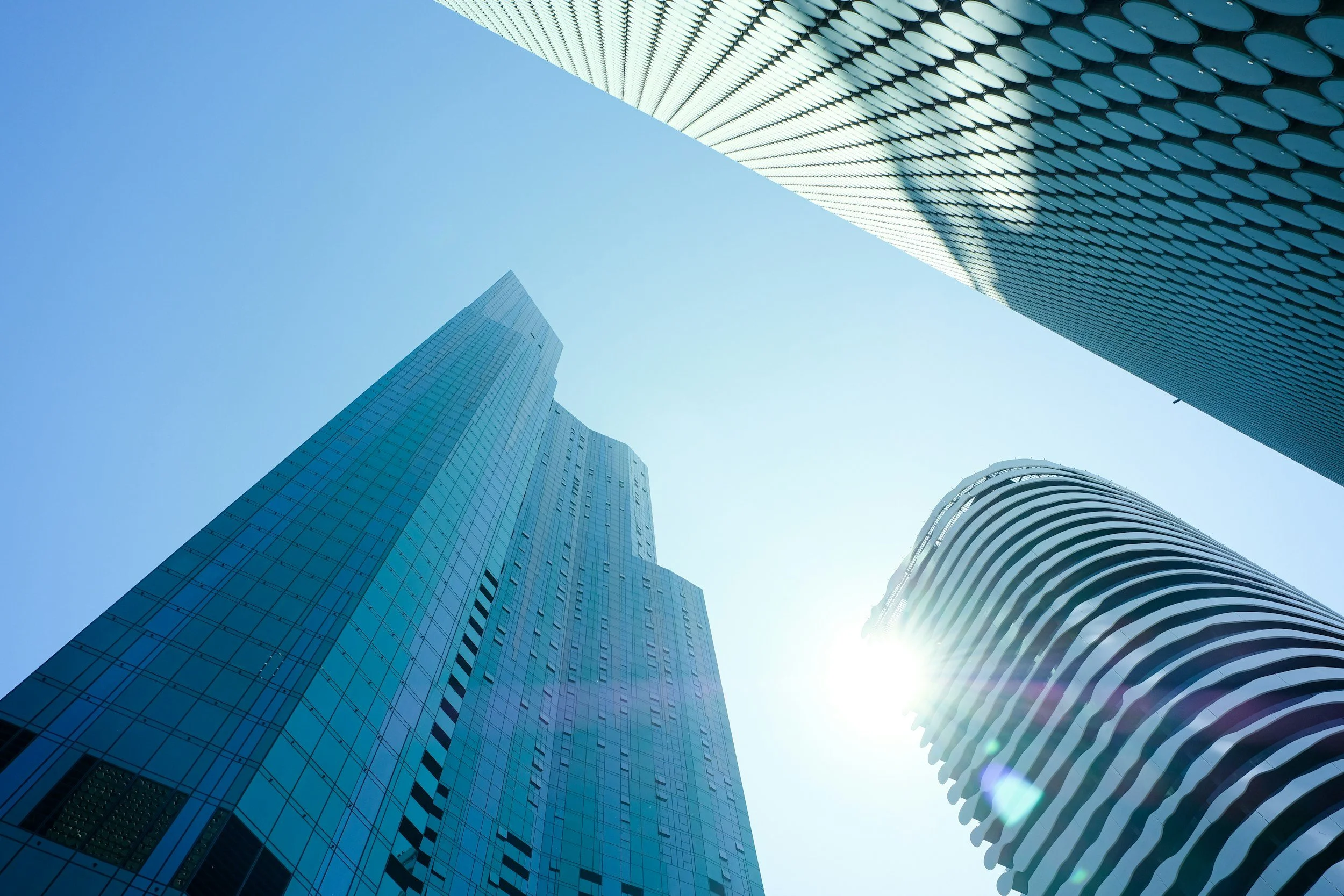 Modern skyscrapers viewed from below, reflecting the architectural, institutional tone of Velvet Legacy Holdings LLC.