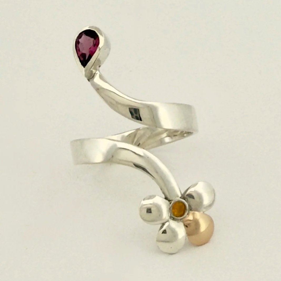 Forged flower ring. Rhodolite garnet, Yellow Sapphire, Sterling silver and 14kt gold.