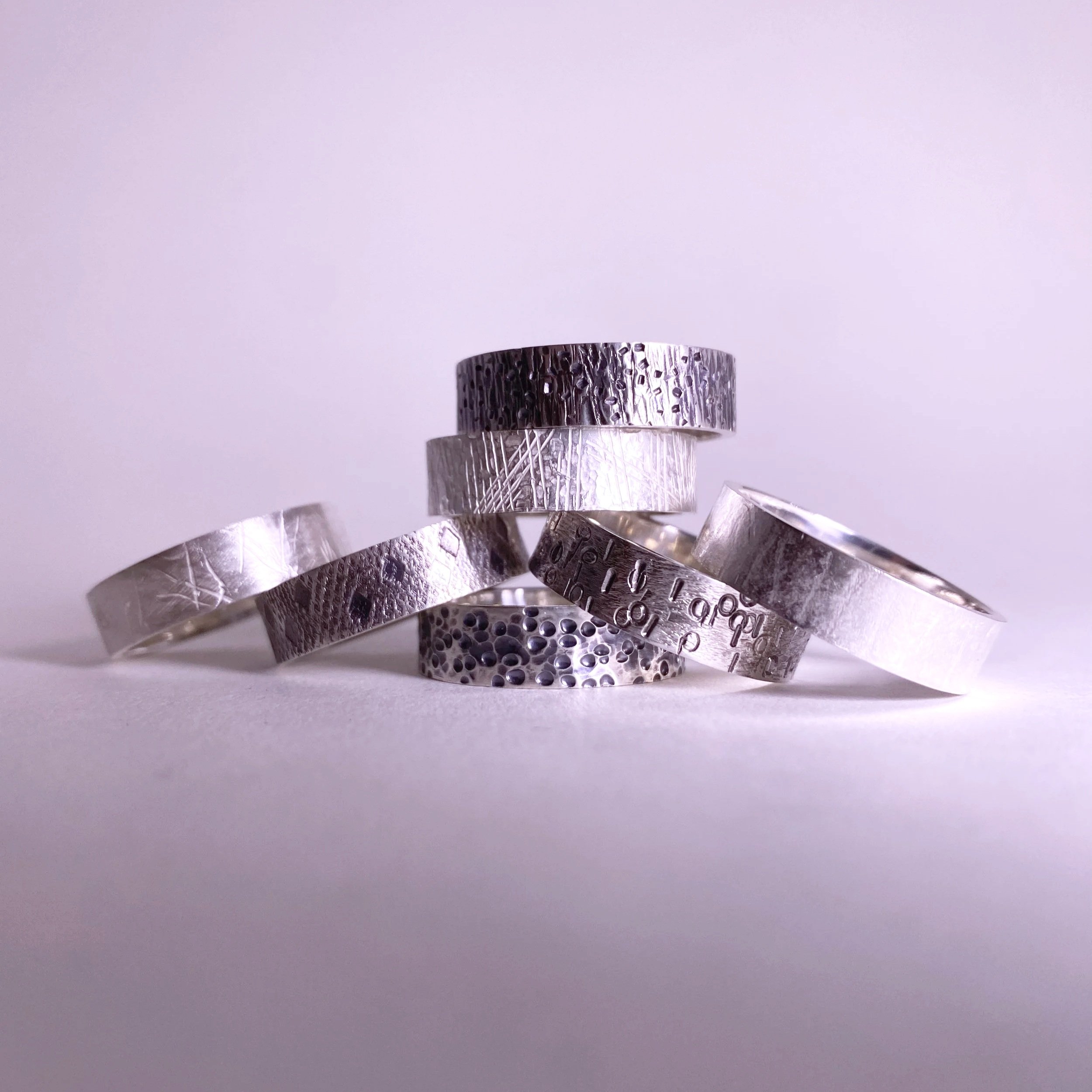 Seven textured ring bands