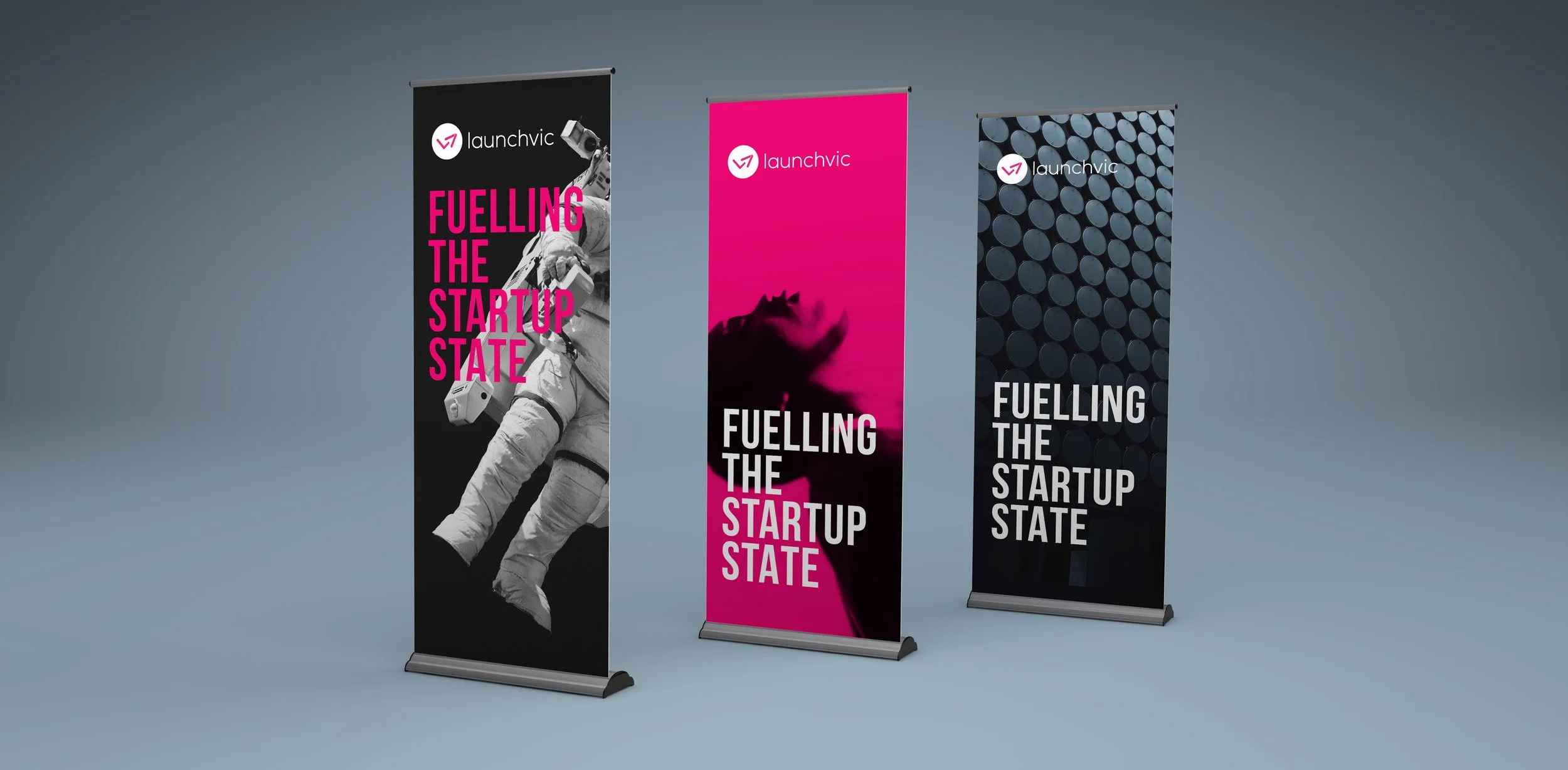 Three vertical banners with the launchvic logo and the slogan "Fuelling the startup state." The first banner features an astronaut and black background with pink text. The second banner has a pink background with a silhouette of a dog and white text.