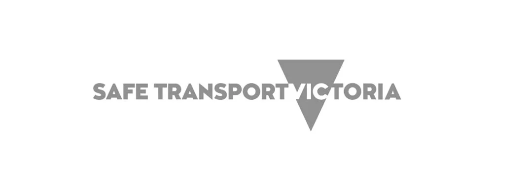 Logo with the text 'SAFE TRANSPORT VICTORIA' and a downward-pointing triangle in between the words.
