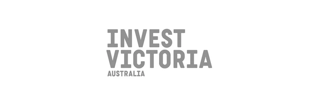 Text graphic reading 'Invest Victoria Australia' in bold gray letters.