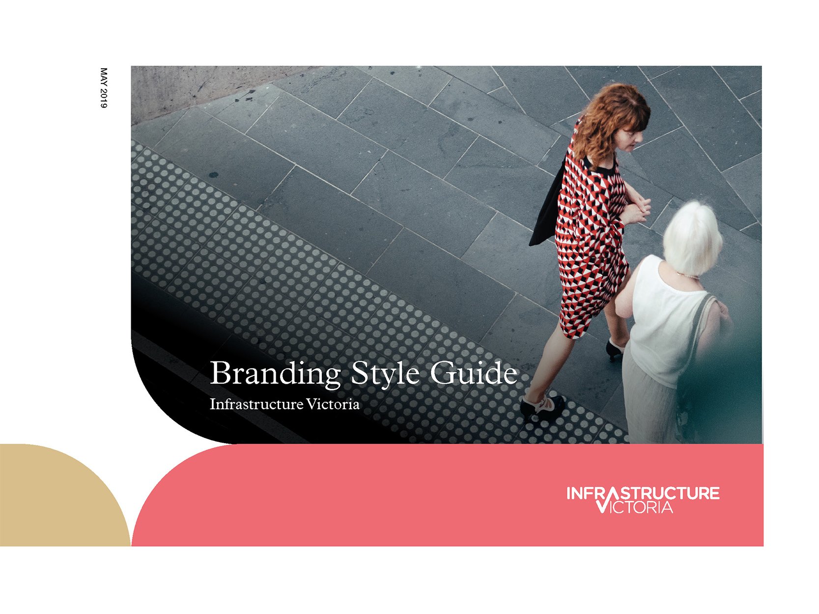 Cover page of a Branding Style Guide for Infrastructure Victoria, featuring a top-down photograph of two women walking on a sidewalk, one with red curly hair wearing a geometric patterned dress and the other with short white hair in a light-colored d