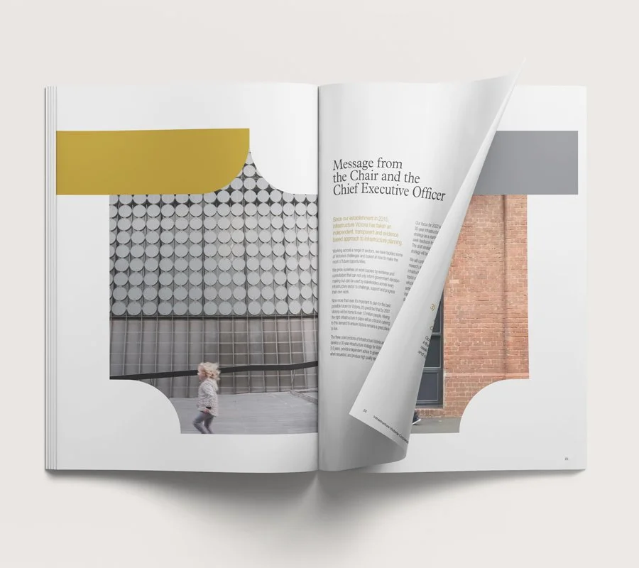 Open magazine with a partially turned page showing an article titled "Message from the Chair and the Chief Executive Officer" with a photograph of a building exterior featuring a patterned wall and a woman walking.
