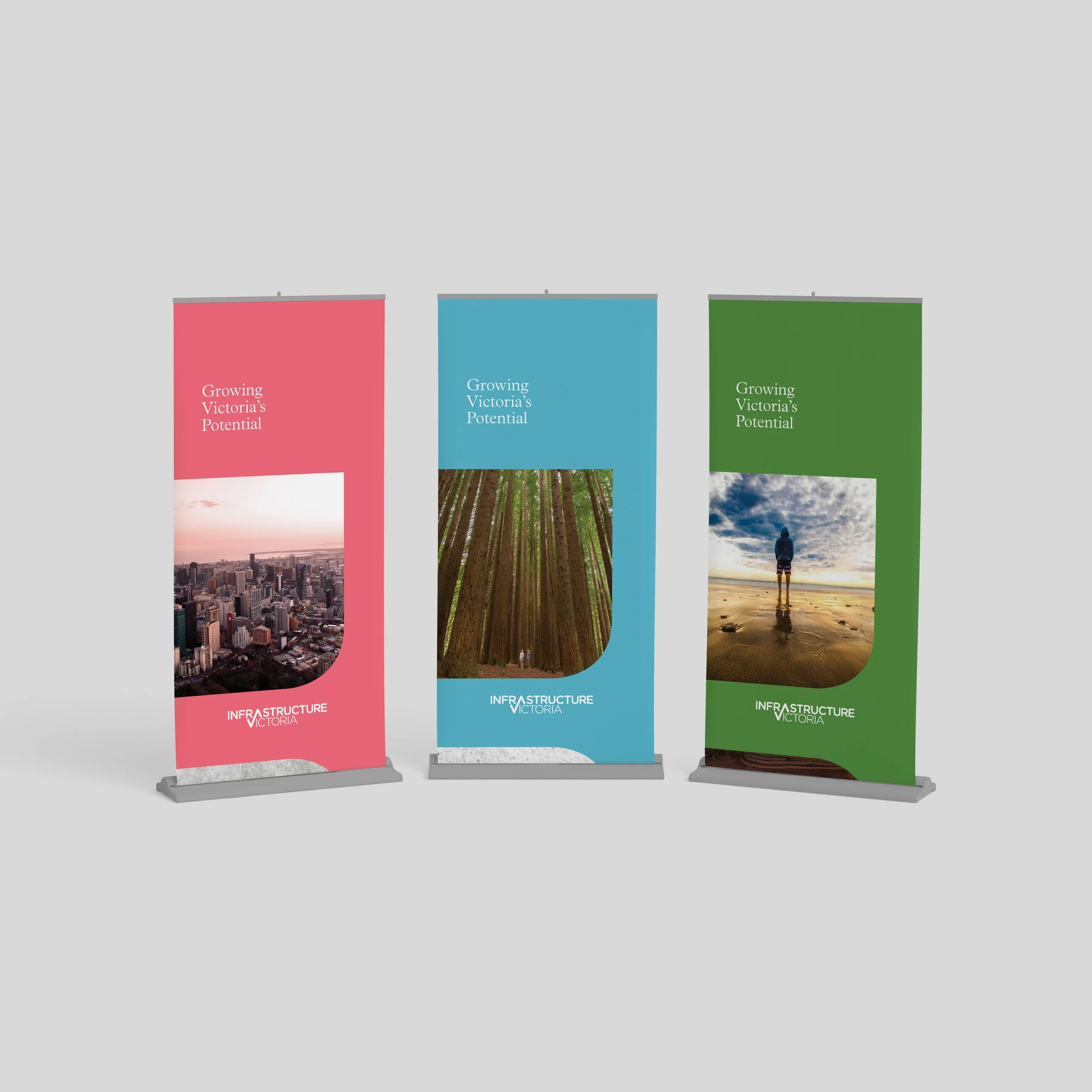 Three vertical banners, from left to right: pink with city skyline, blue with forest trees, green with person on beach. All show the Infrastructure Victoria logo in white.