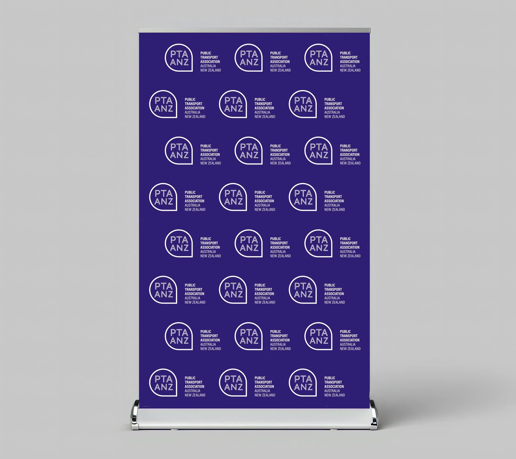 Blue banner with repeated white PTAANZ logo and text for Public Transport Association Australia and New Zealand on gray background.