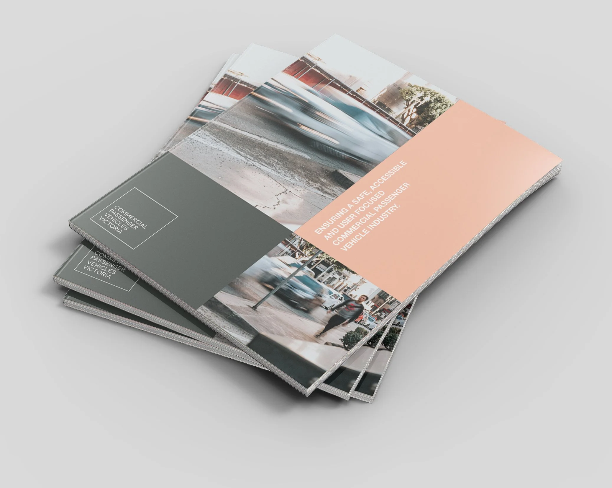 Pamphlets with vehicle images and text related to accessible and commercial passenger vehicle industry in Victoria, stacked on a white surface.