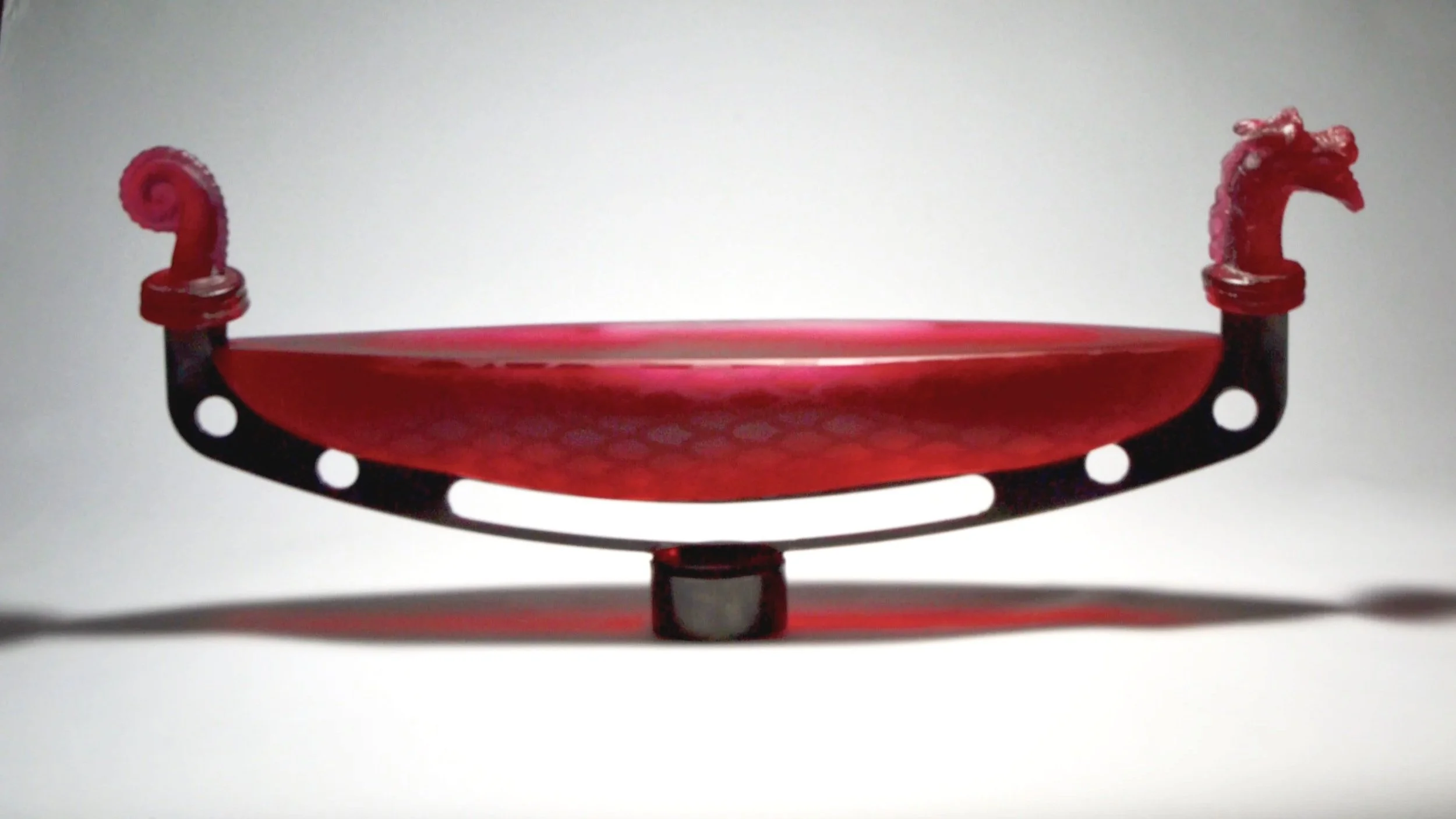 Dragon Boat - a sculpture representing a dragon boat, made from cast glass and steel.
