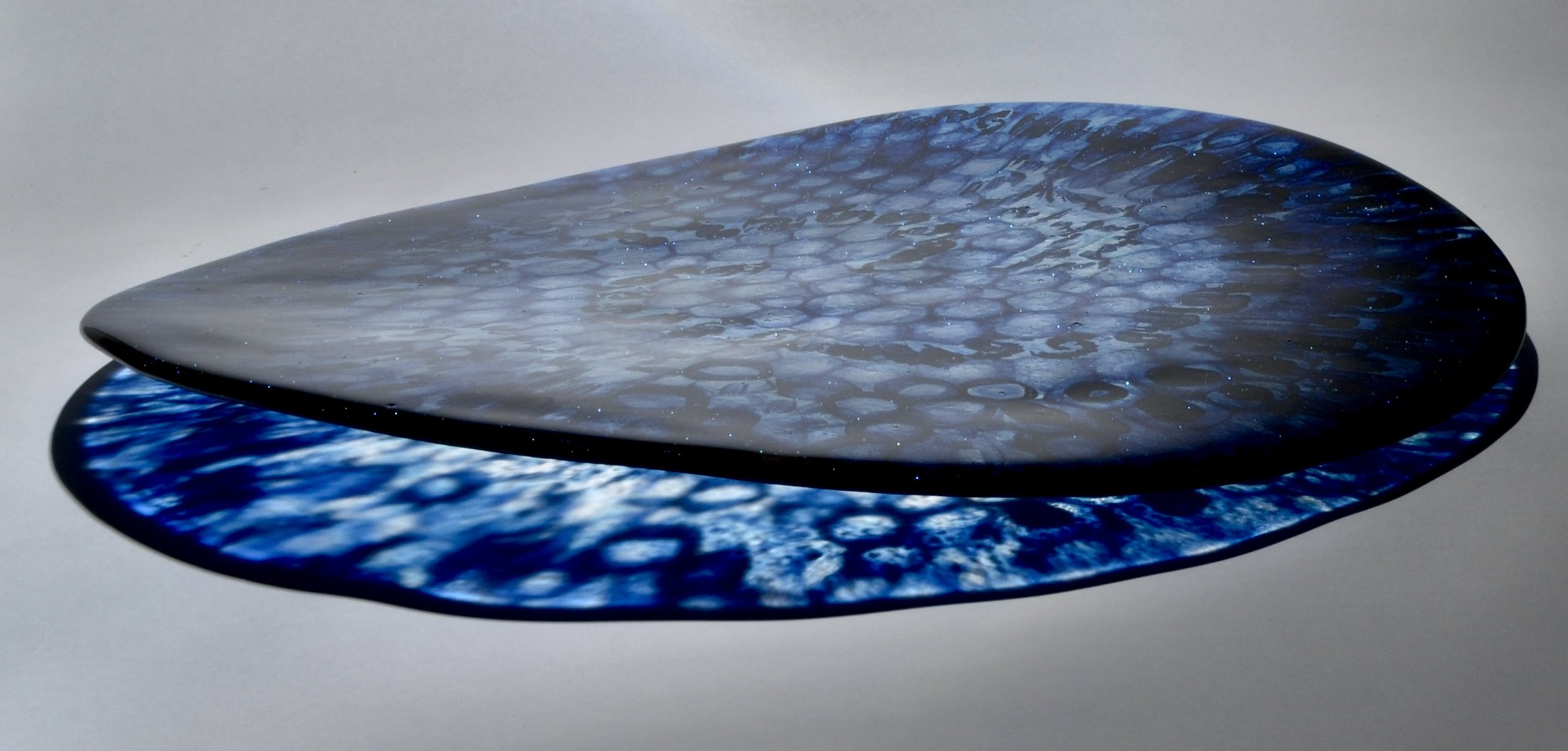 Cosmos - large curved glass platter made of hand pulled aventurine blue murrine fused and slumped.