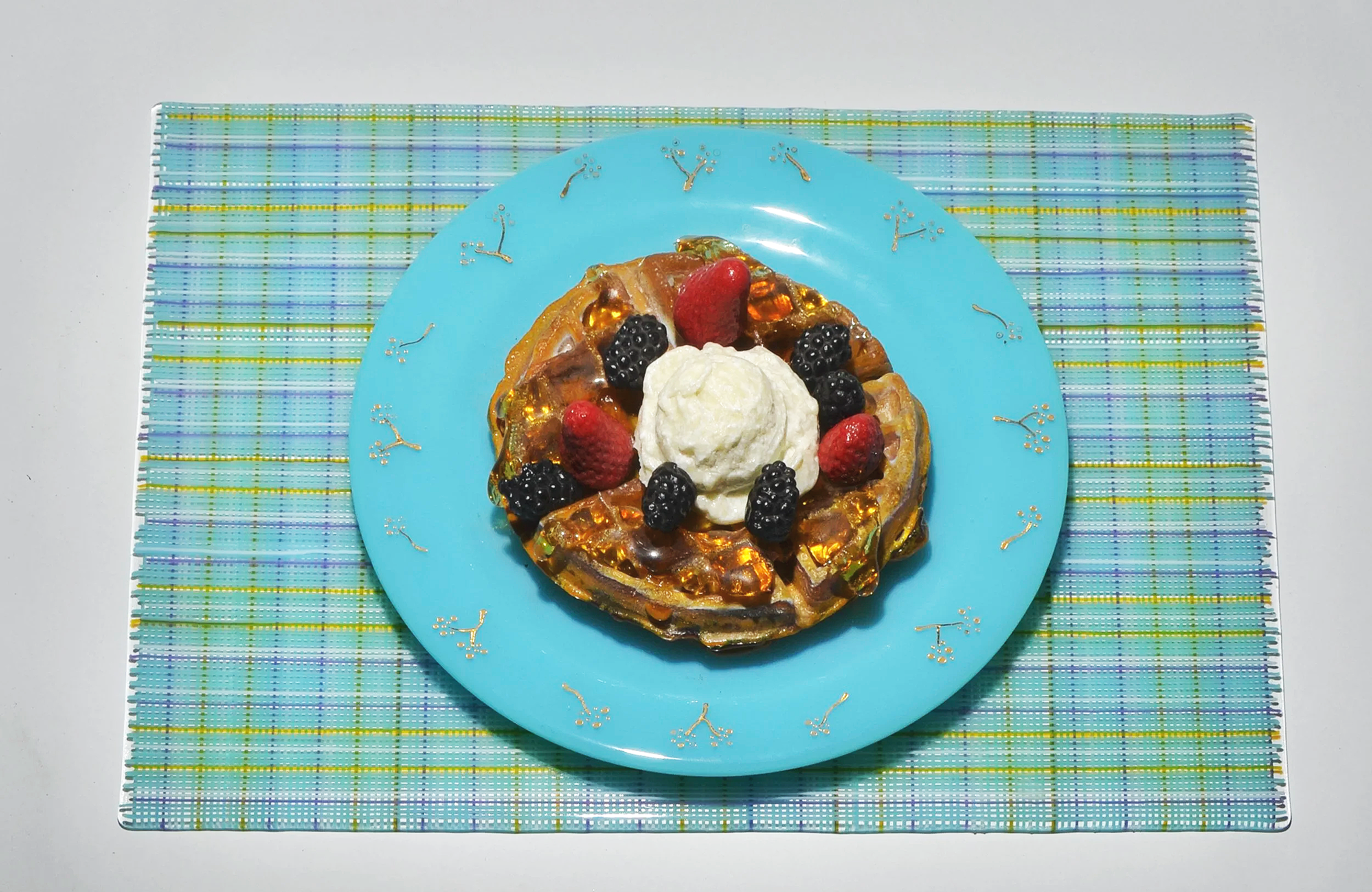 Breakfast at Tiffany's - a cast glass waffle, ice cream, syrup and berries on a blue fused glass plate with gold accents, resting on a fused glass placemat