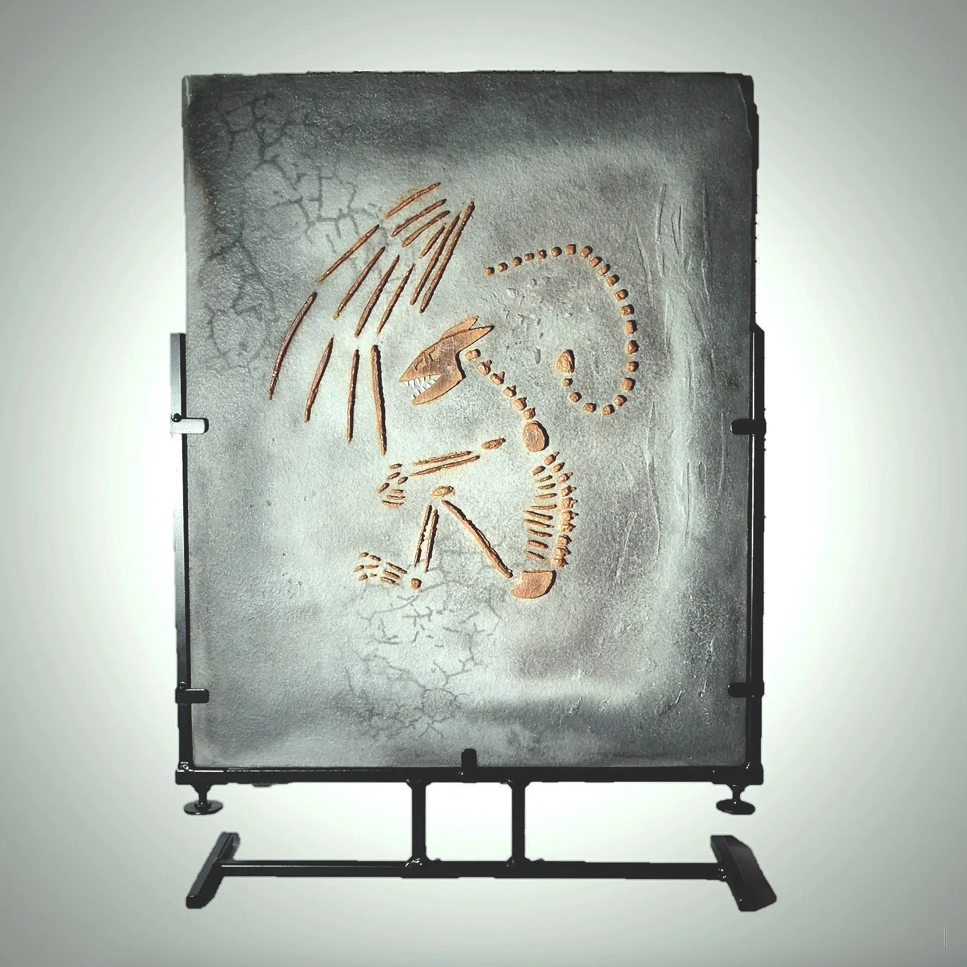 Dracolith - surface cast glass representing a fossilized dragon on a steel stand.
