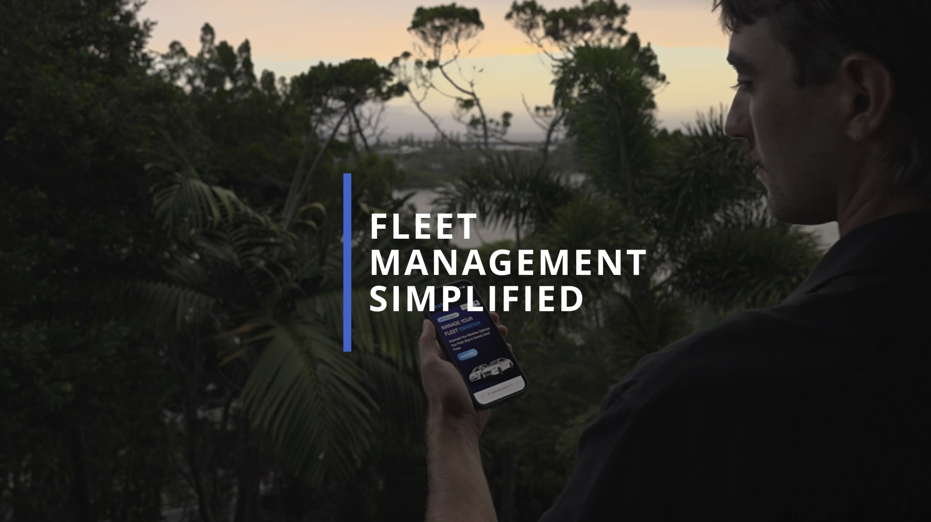 A man holding a smartphone outdoors at sunset, with trees and a lake in the background. Text overlay reads "Fleet Management Simplified."