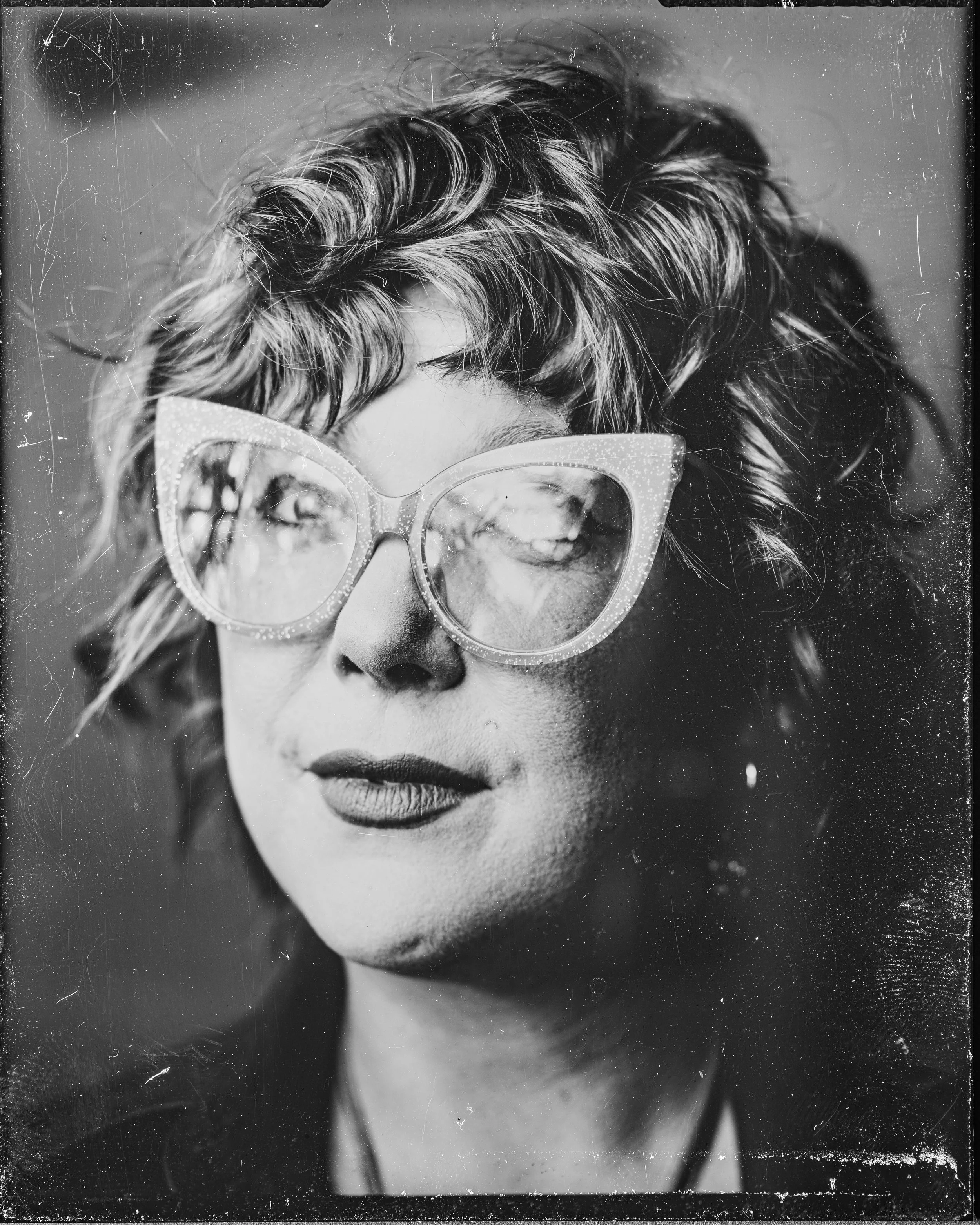 A tintype photograph of Kaycie Surrell, the Grants & Outreach Chair for Far Afield