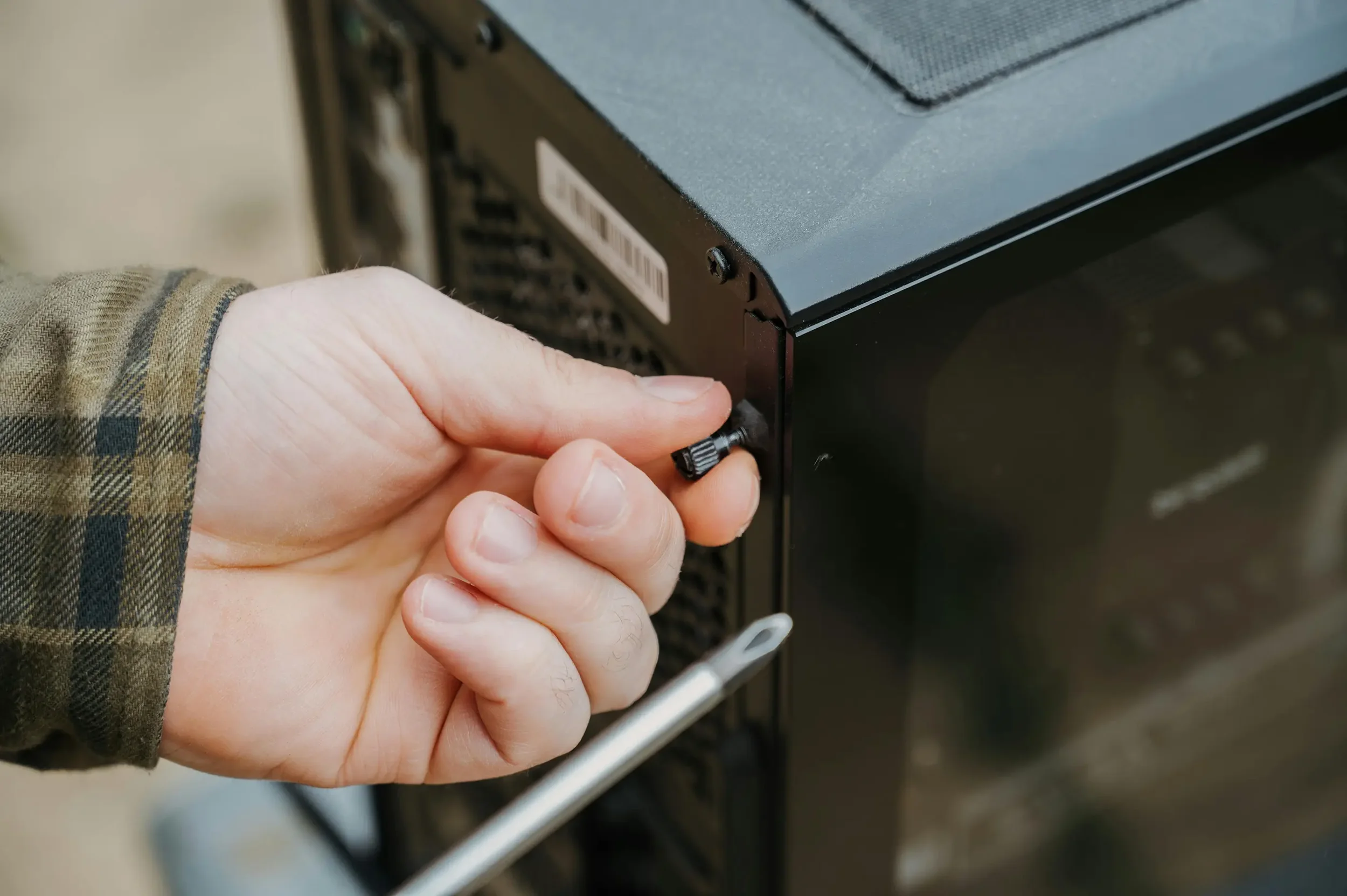 Computer case being screwed