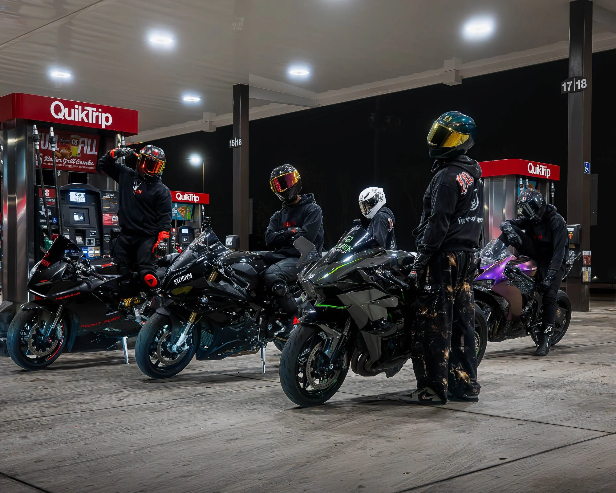 EXCIDIVM riders with sport motorcycles wearing streetwear at night gas station
