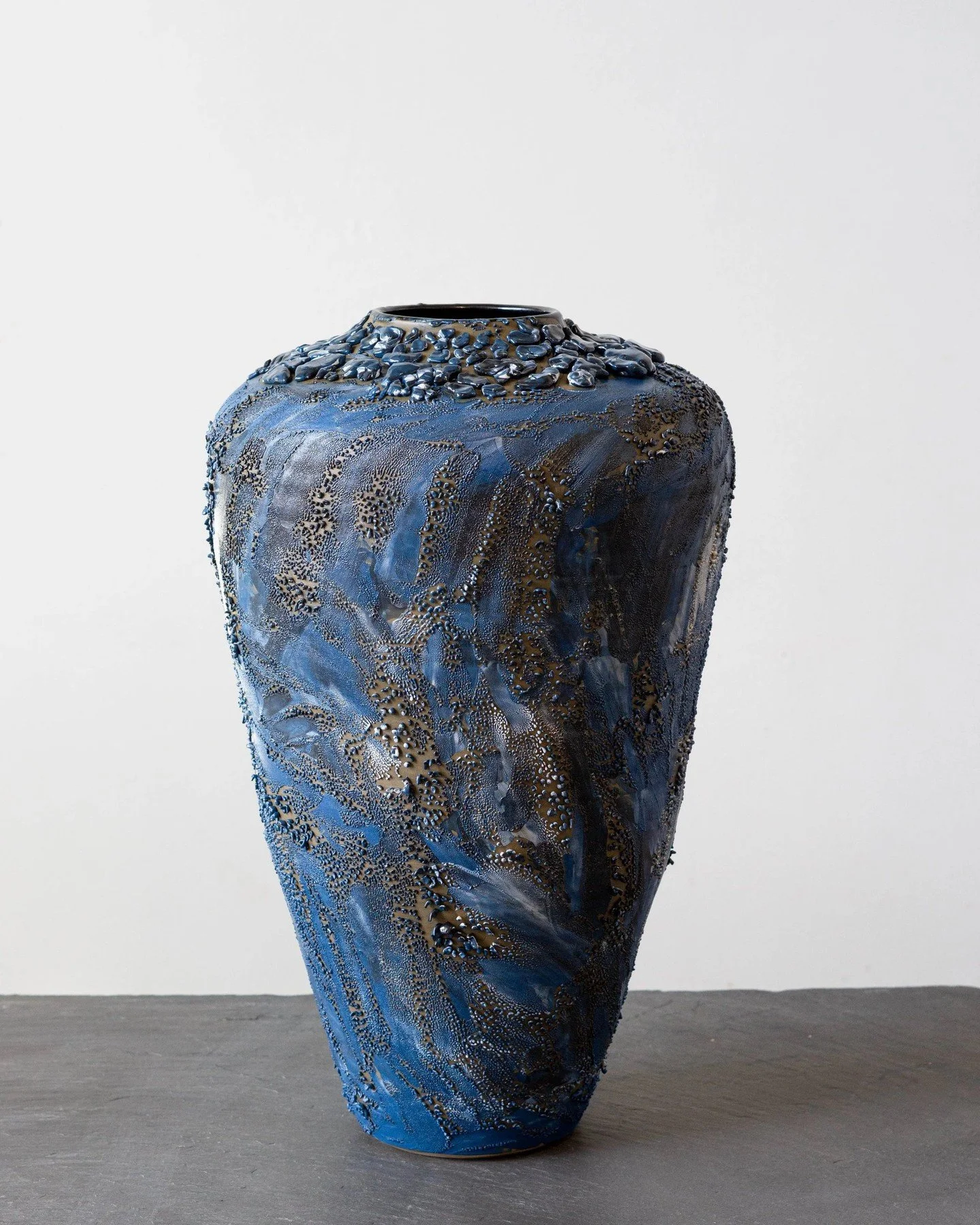 ESME COLOR CRAWL.⁠
⁠
A vessel with the mood of deep water. The Esme Color Crawl by Kalya O&rsquo;Donoghue is built through layers of blue glaze, mineral texture and metallic surface detail&mdash;somewhere between tide pool and artifact pulled from be