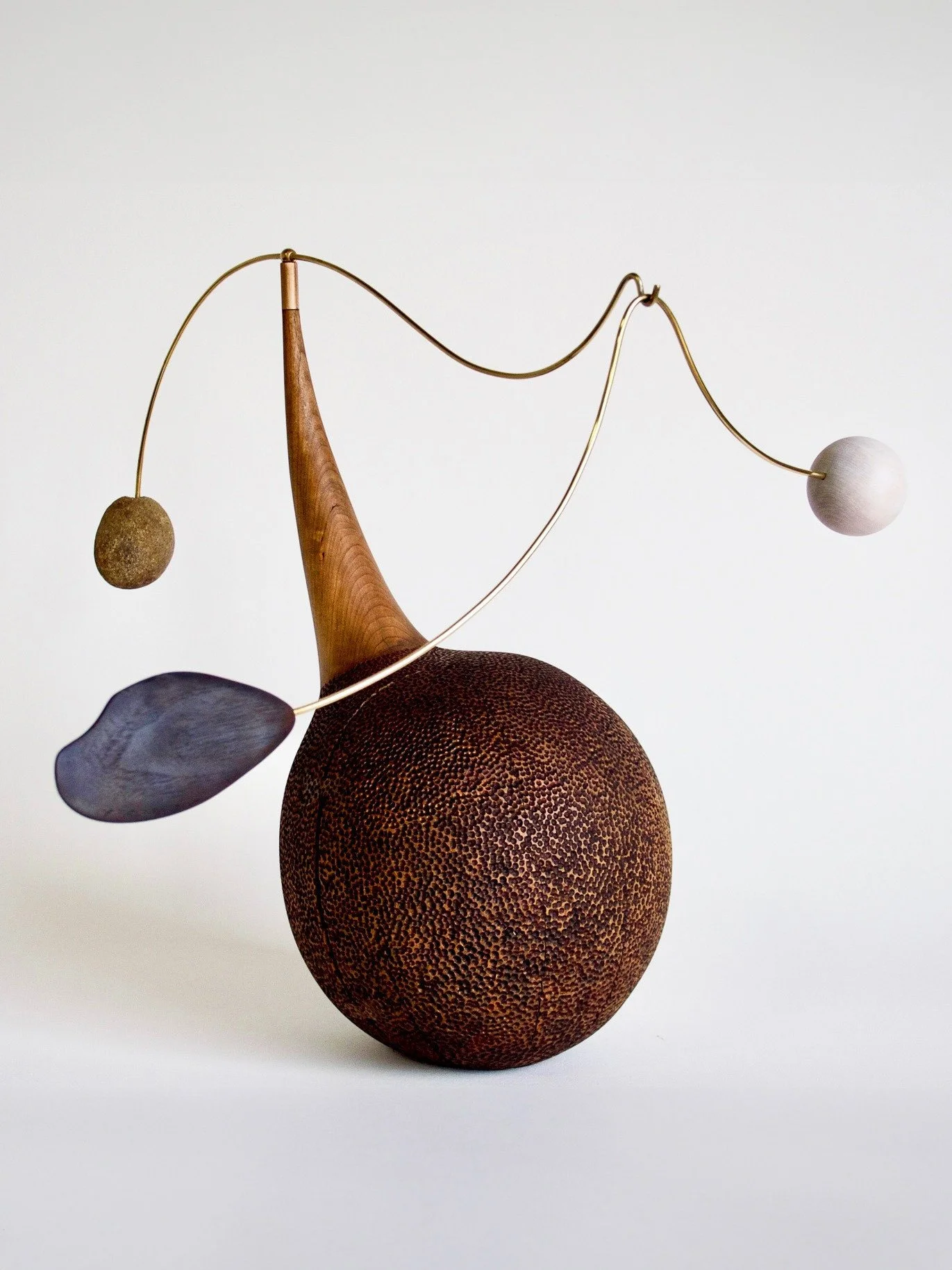 TABLETOP MOBILE.⁠
⁠
A little gravity, sleight of hand. Casey Johnson&rsquo;s tabletop mobile collection balances carved wood, brass and natural stone into a composition that feels impossibly light&mdash;each element held in tension, shifting subtly w