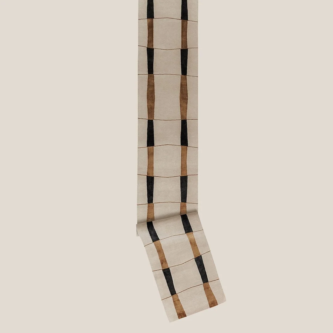 RHIZOME.⁠
⁠
A grid, but not the obedient kind. Art + Loom&rsquo;s Rhizome Rug stretches a repeating sequence of rectangles down the length of the runner, while slightly wavering lines and pinched bands keep the geometry from ever feeling too exact. T