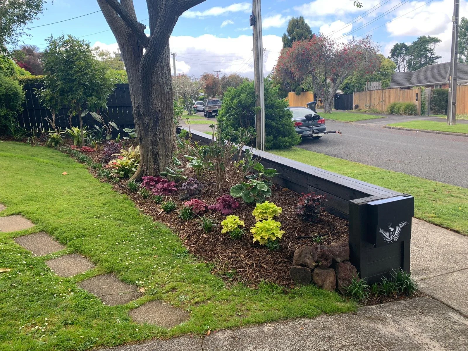 Remodelled garden bed with new garden wall and custom large letterbox
