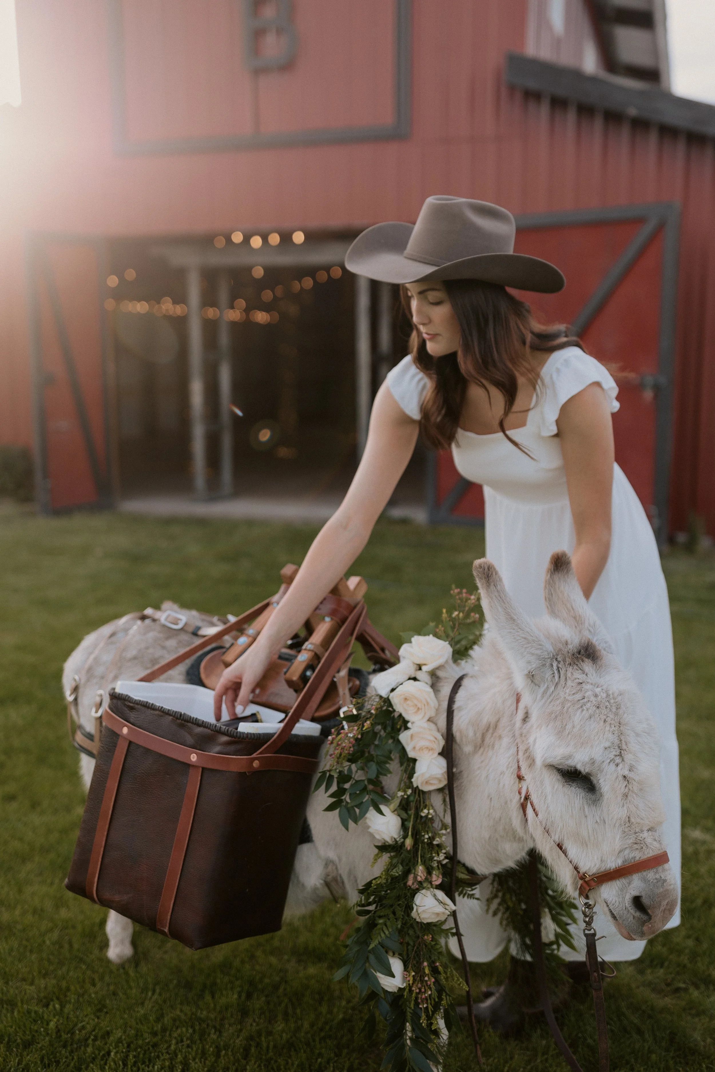 western montana bride reaching for beverage at cocktail hour of her Bigfork Montana wedding with Montana Beer Burros 