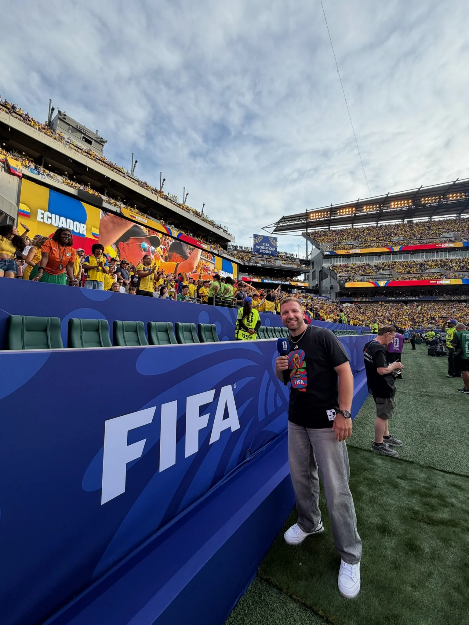 Lee Posing with Crowd on Field.jpeg