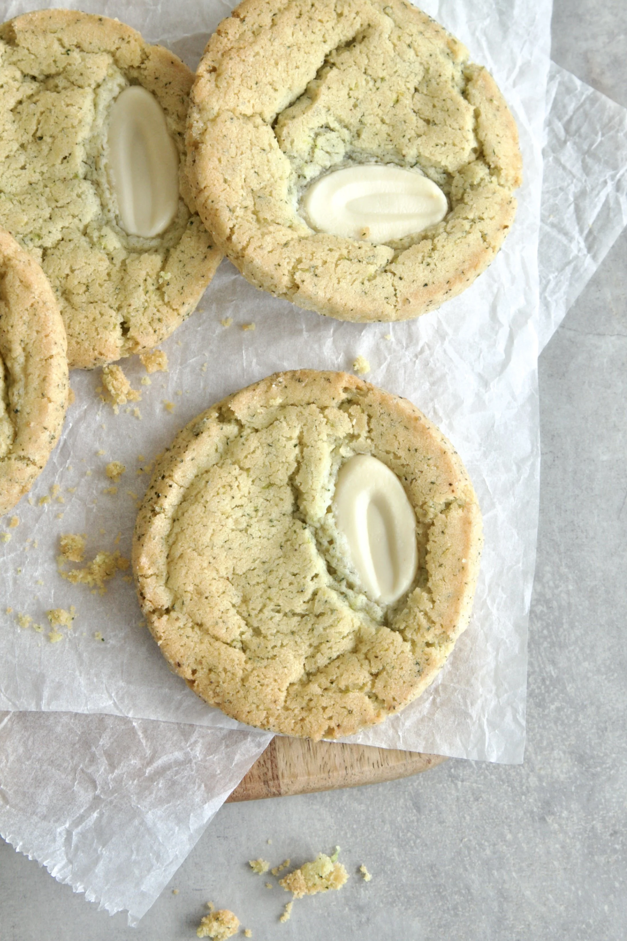 mojito lime cookies with a piece of white chocolate in the center. Starkes and living on a piece of baking paper
