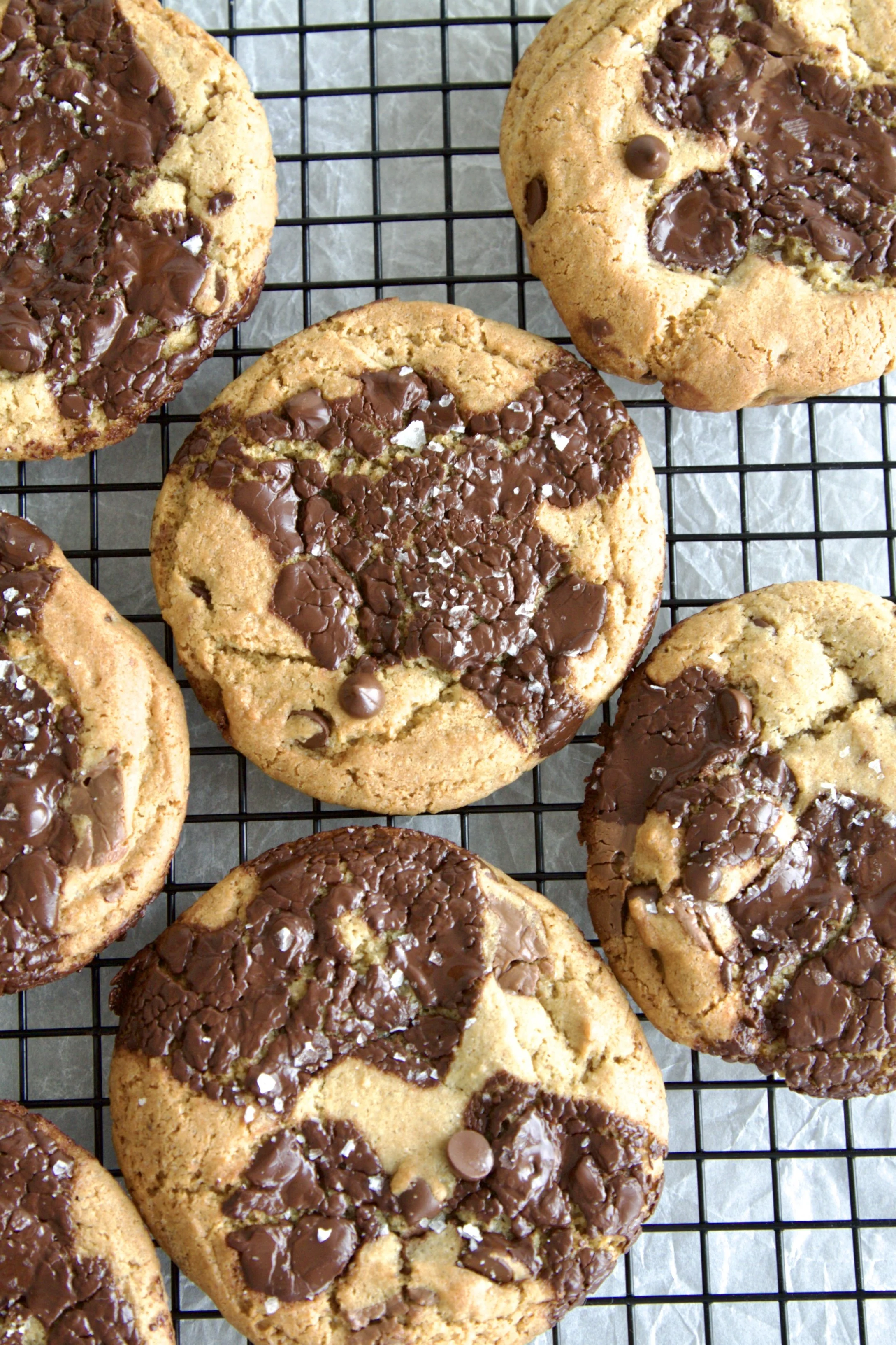 browned butter chocolate chip cookies with melted chocolate and sprinkled with sea salt