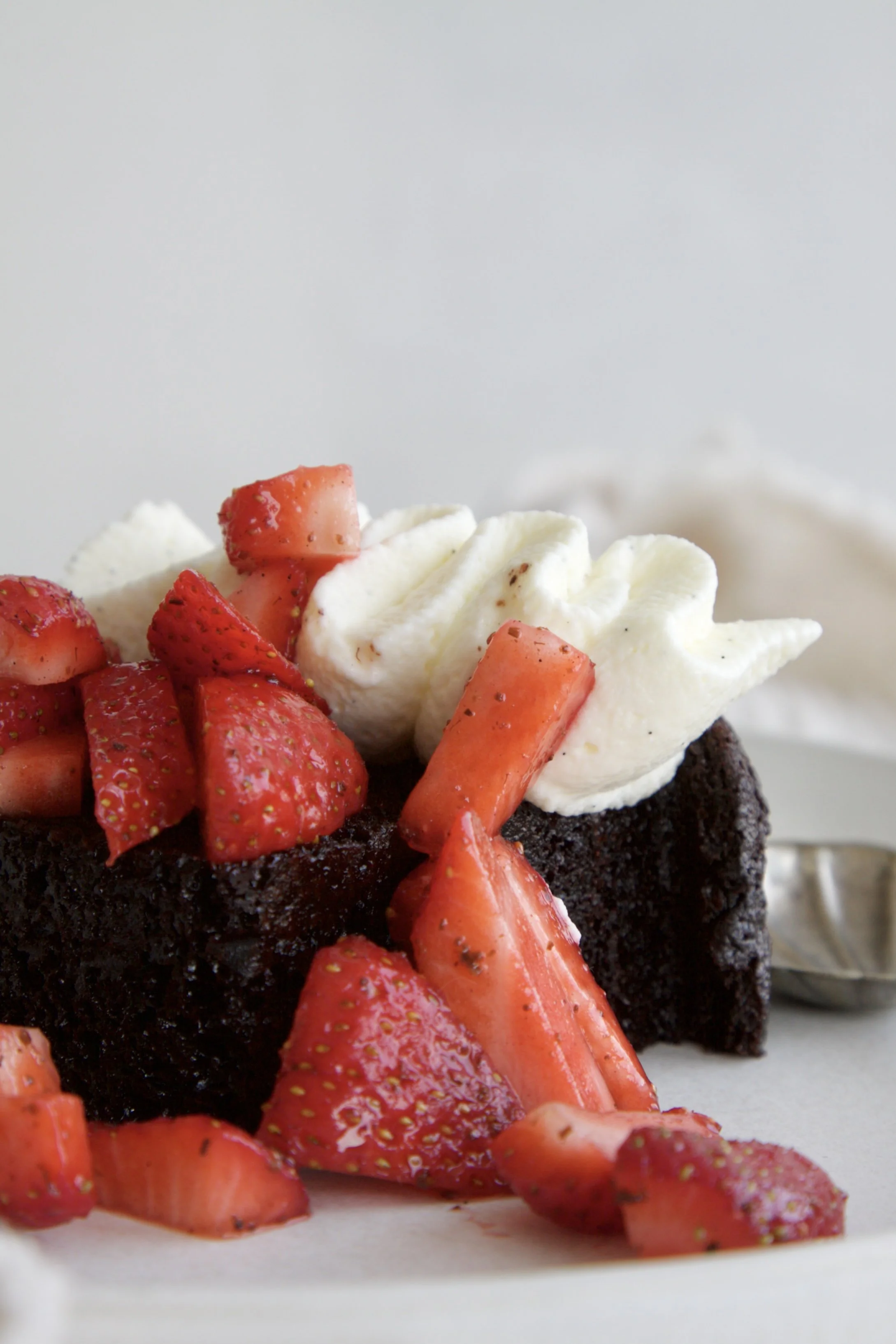 slice of chocolate cake with mascarpone cream and strawberries