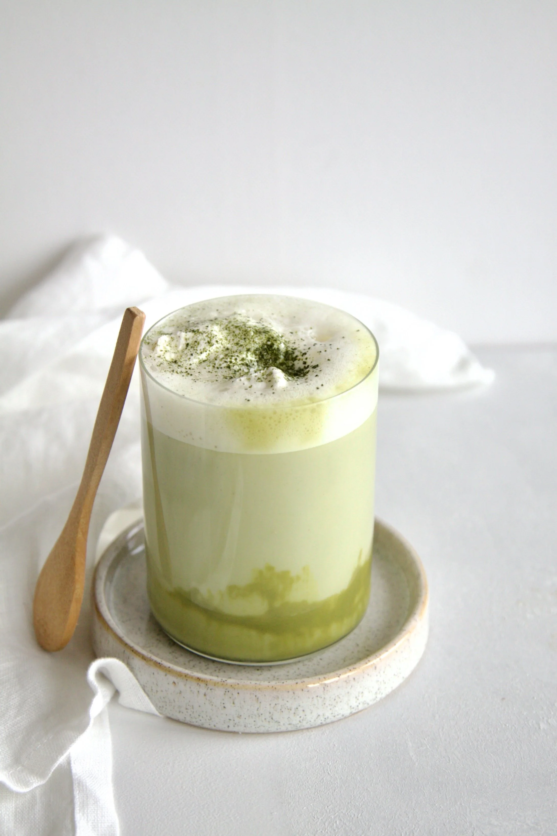 glass with a green pistachio matcha latte