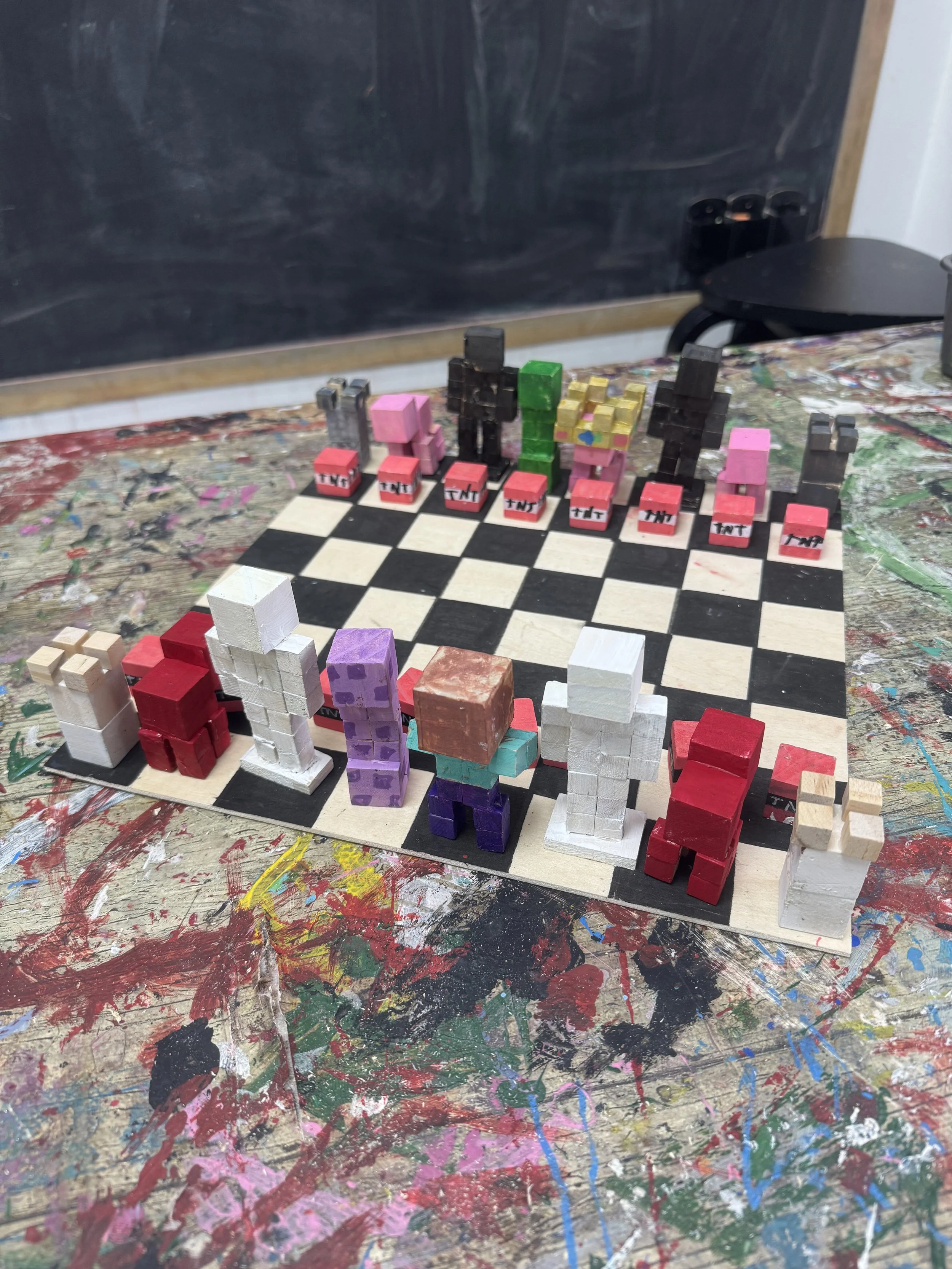 Miniature wooden figurines arranged on a chessboard, representing characters from a game or story.