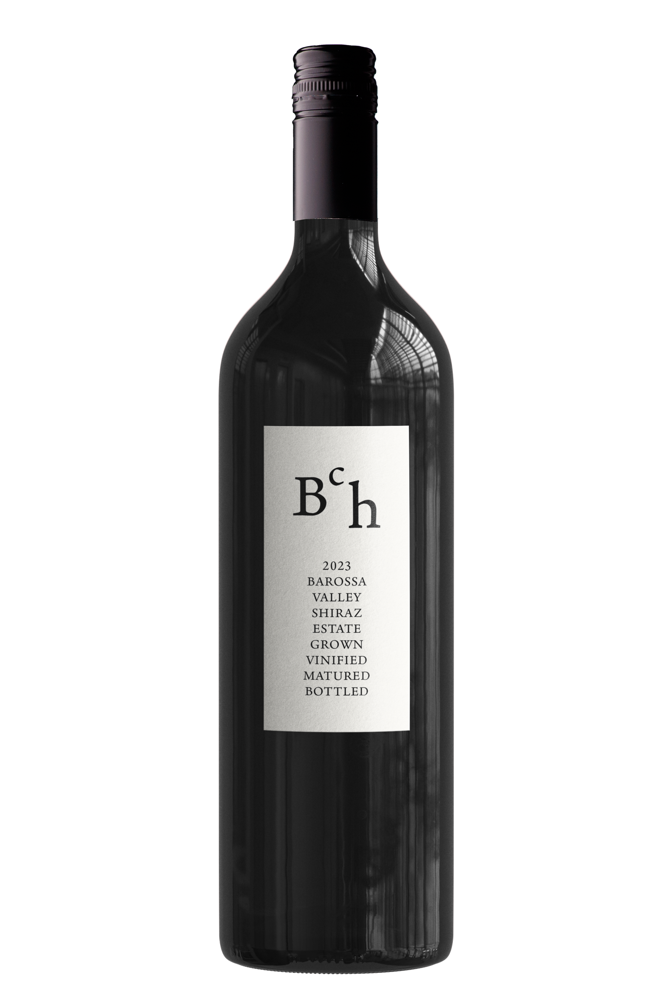 A dark wine bottle with a white label indicating it is a 2023 Barossa Valley Shiraz, estate grown, vinified, matured, and bottled.