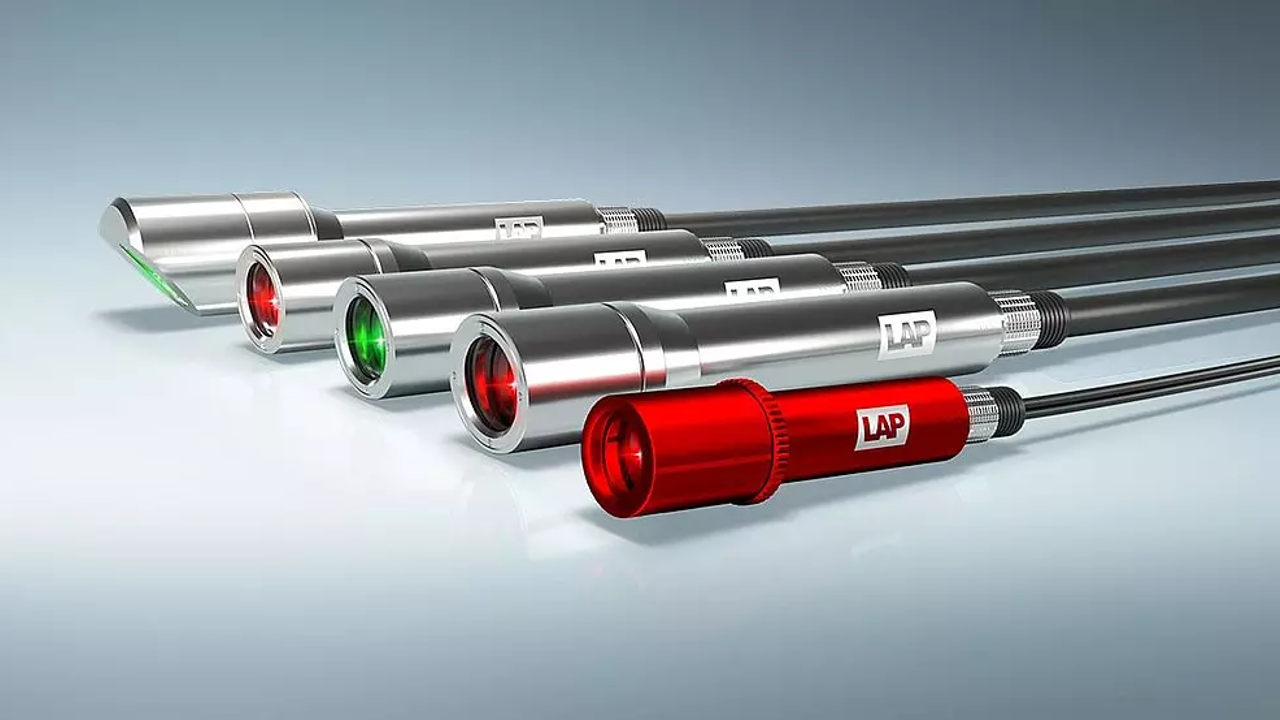 Six endoscopes with varying colored lights at their tips, including green, red, and white, arranged diagonally on a light background.
